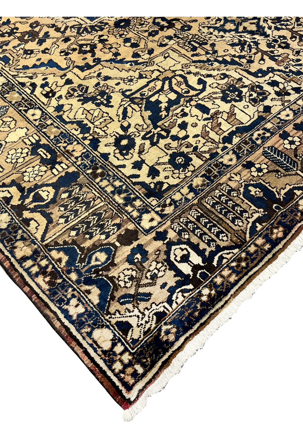 Edge detail of vintage Heriz rug in navy and ivory showing strong wool pile and traditional hand knotted craftsmanship