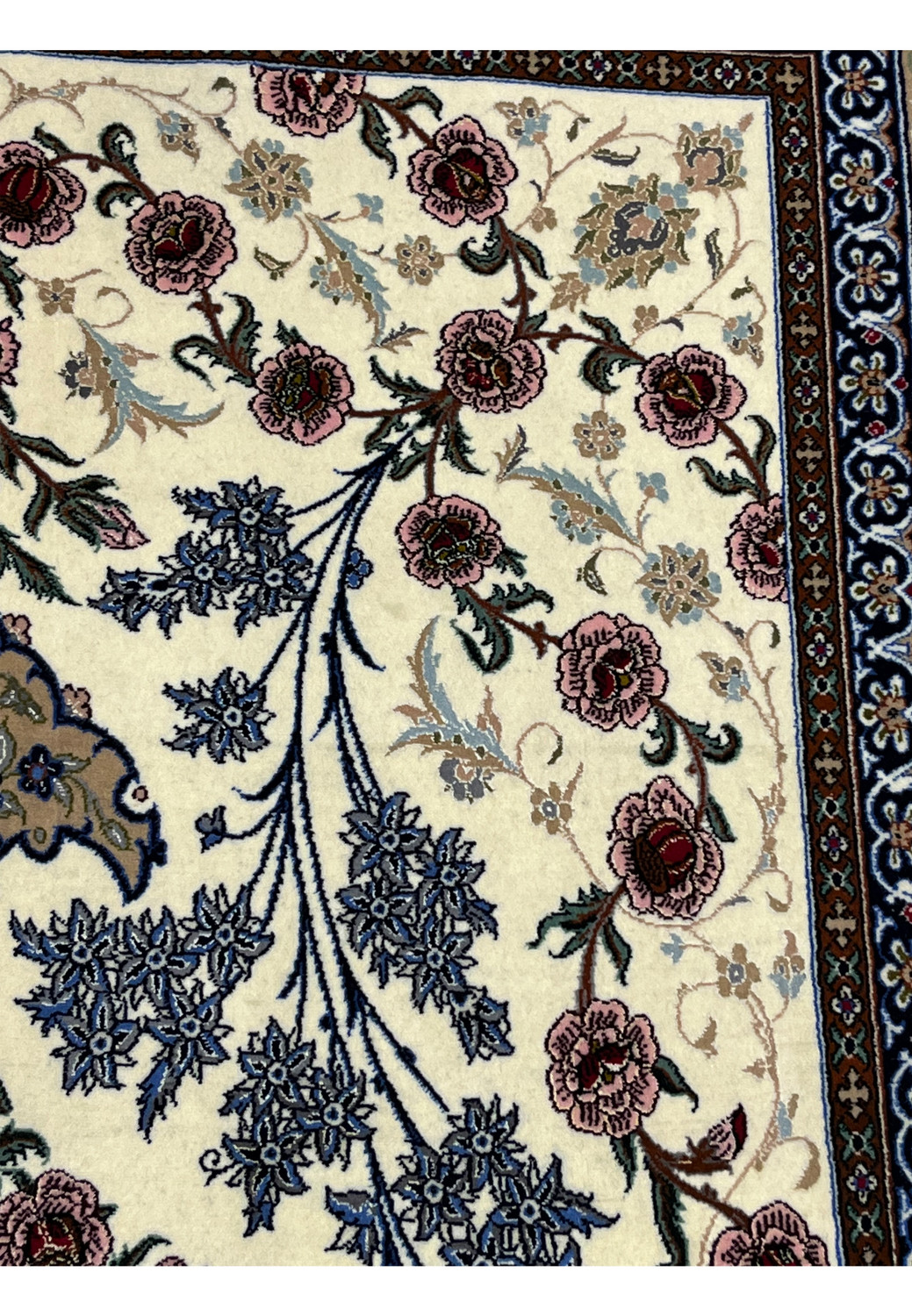 Floral motif detail Persian Isfahan wool silk rug blue cornflower clusters pink peony blooms ivory ground Darri