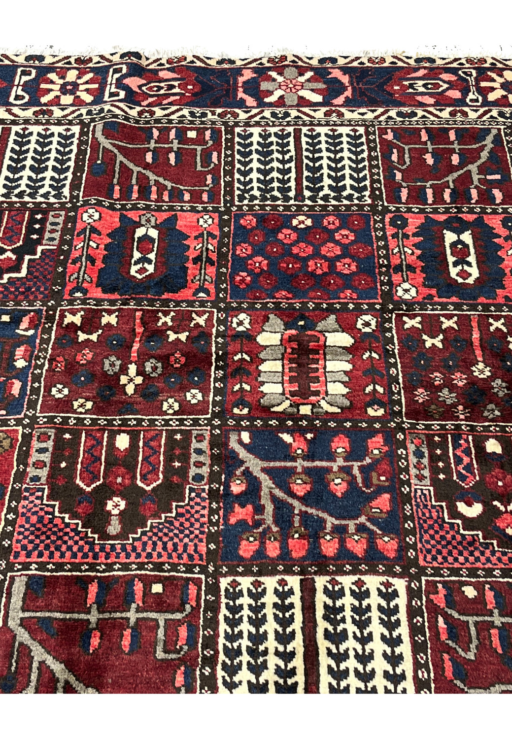 Zoomed panel detail showing weeping willow and flowering shrub compartments in 6'8x10 Bakhtiari rug