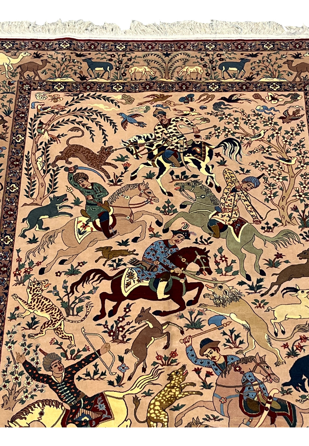 Upper field of 5x8 Persian Isfahan Seirafian hunting rug showing horsemen and leopard on blush