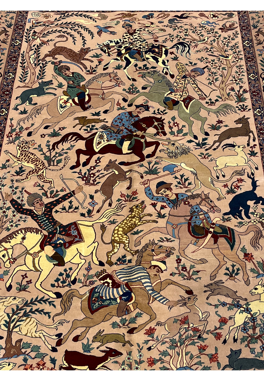 Full hunting scene detail of 5x8 Persian Isfahan Seirafian rug with riders horses and animals