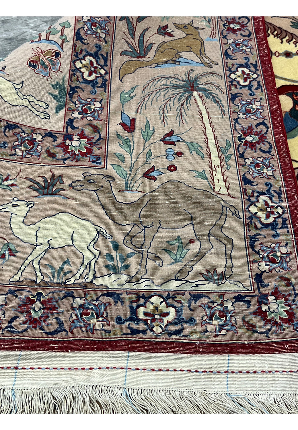 Back side of 5x8 fine Persian Isfahan Seirafian rug showing silk foundation and knot density