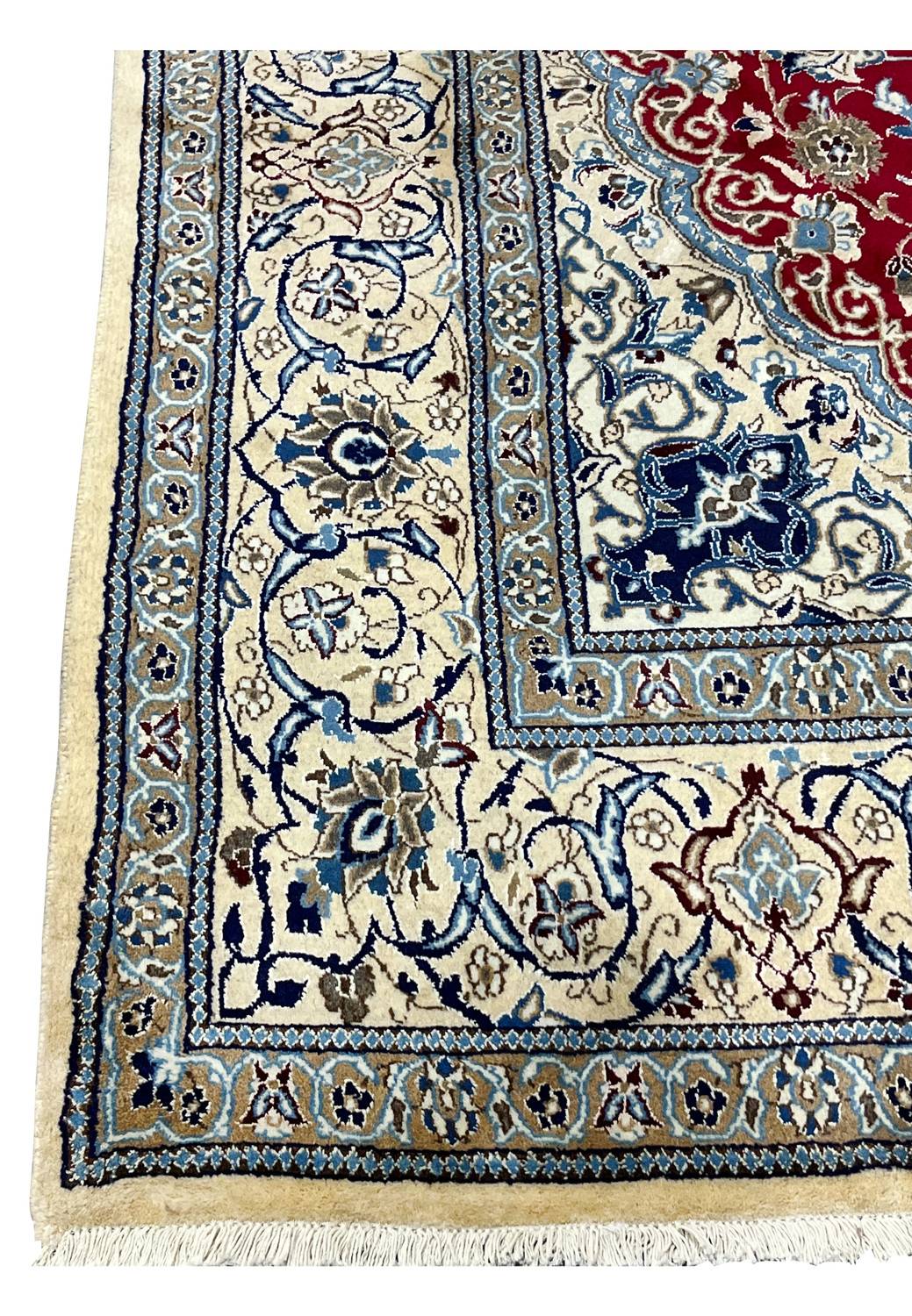 Close view of ivory border on red Persian Nain rug with scrolling floral motifs and fine symmetrical drawing