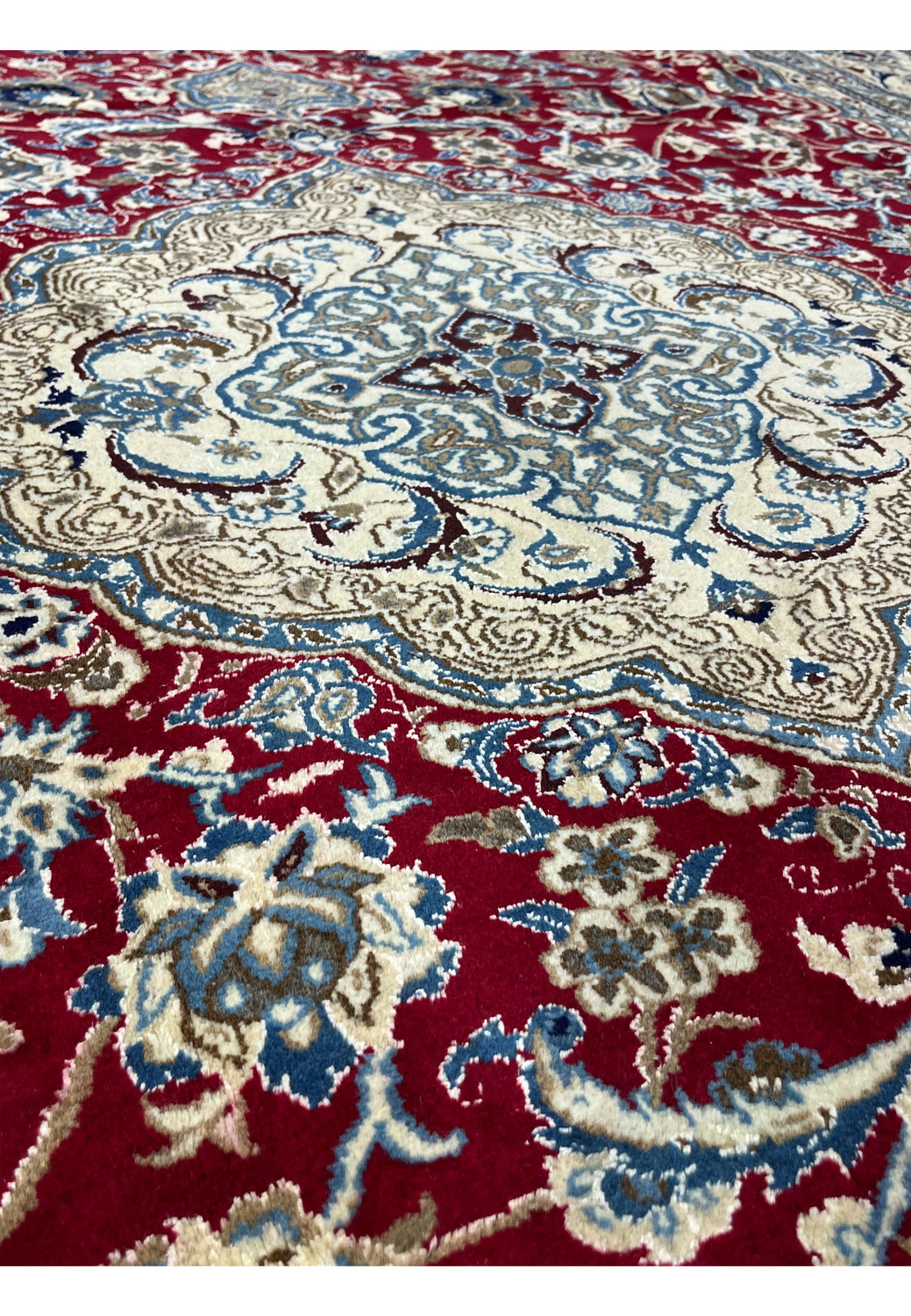 Foundation close-up of Persian Nain rug revealing tight hand knotted structure and fine wool and silk weave