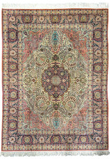 Full view of a 8x10 Persian Tabriz 100% silk rug with intricate floral and medallion design
