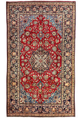 Full overhead view of 8x13 Persian Najafabad rug, rose red field with navy border and layered floral medallion