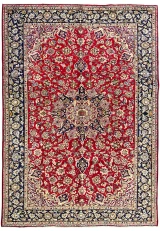 Hand-knotted wool Najafabad showing an allover floral field and central medallion in crimson and navy tones.