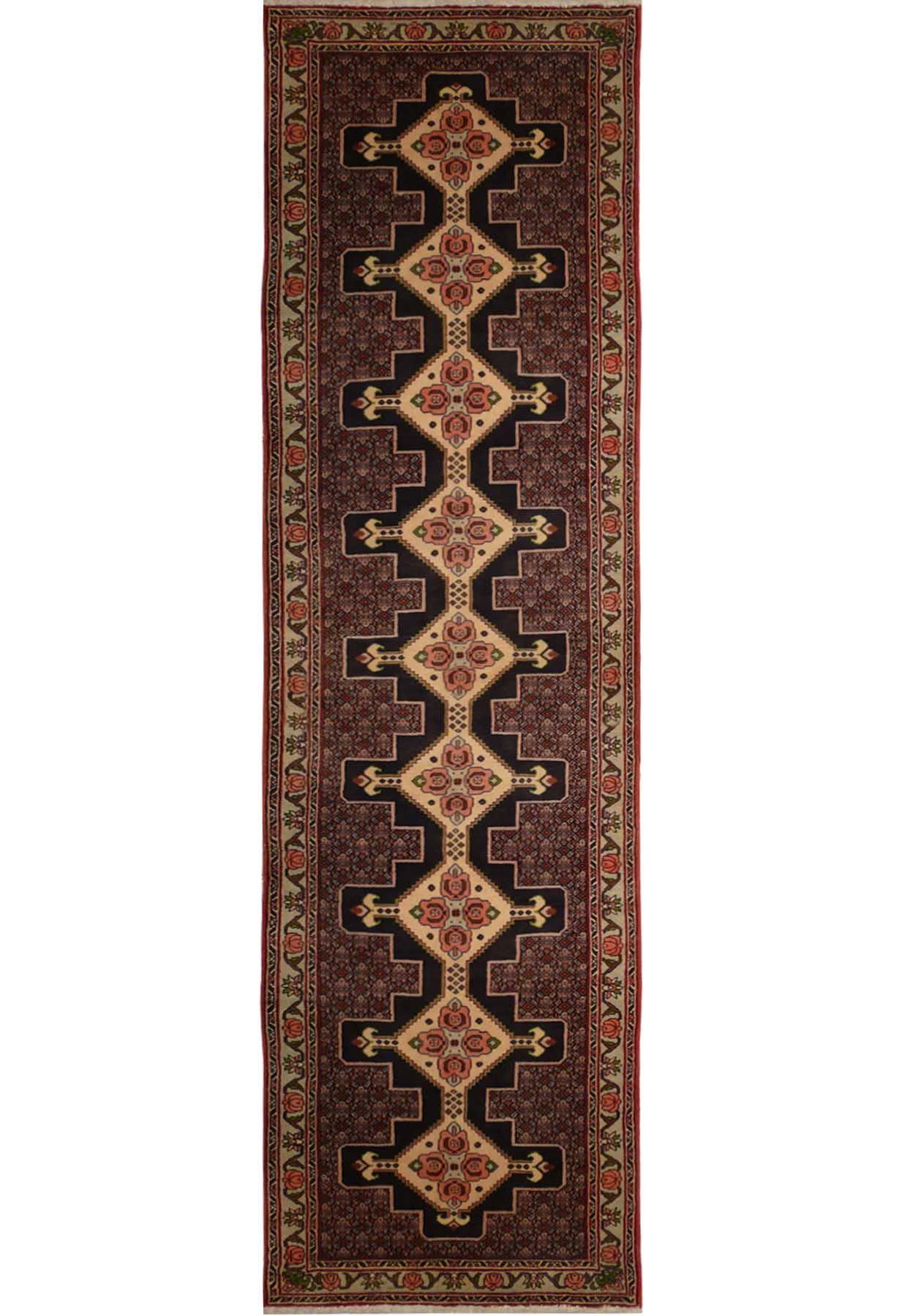 A close-up of a Persian Senneh runner featuring a geometric pattern in shades of blue, red, and ivory.