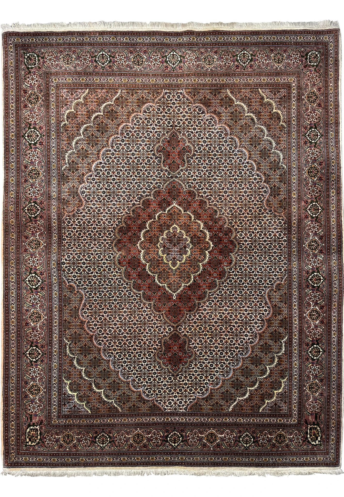 Full view of a 5x7 Persian Tabriz Mahi rug laid out flat, displaying the detailed central medallion, elaborate corner brackets, and the ornate border design with a cream fringe.