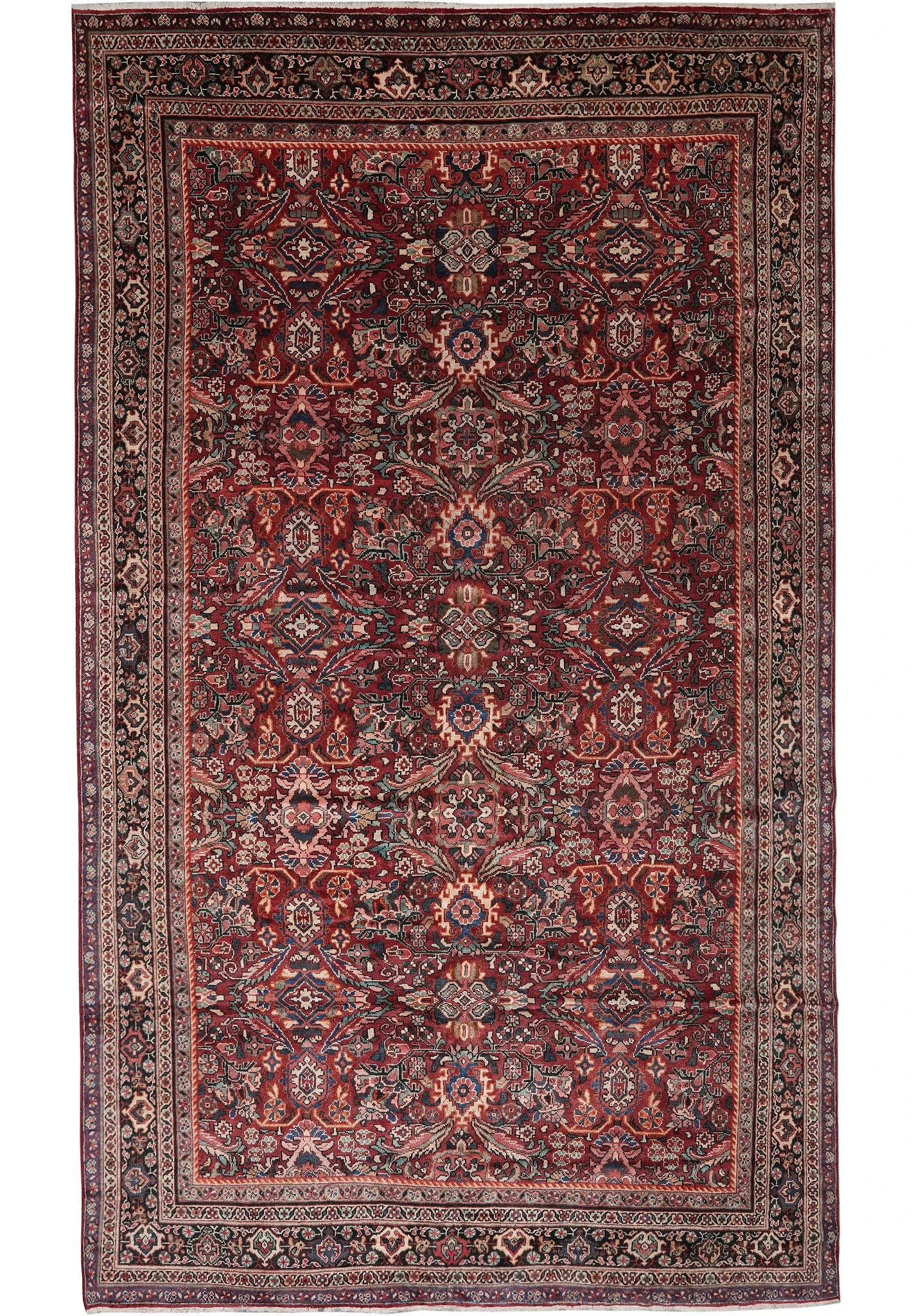 Full overhead view of deep red Persian Mahal rug with all over floral lattice design