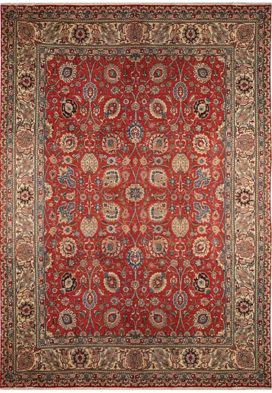 Full view of the vintage 10 x 13'5 Persian Tabriz rug with rusty red allover floral field