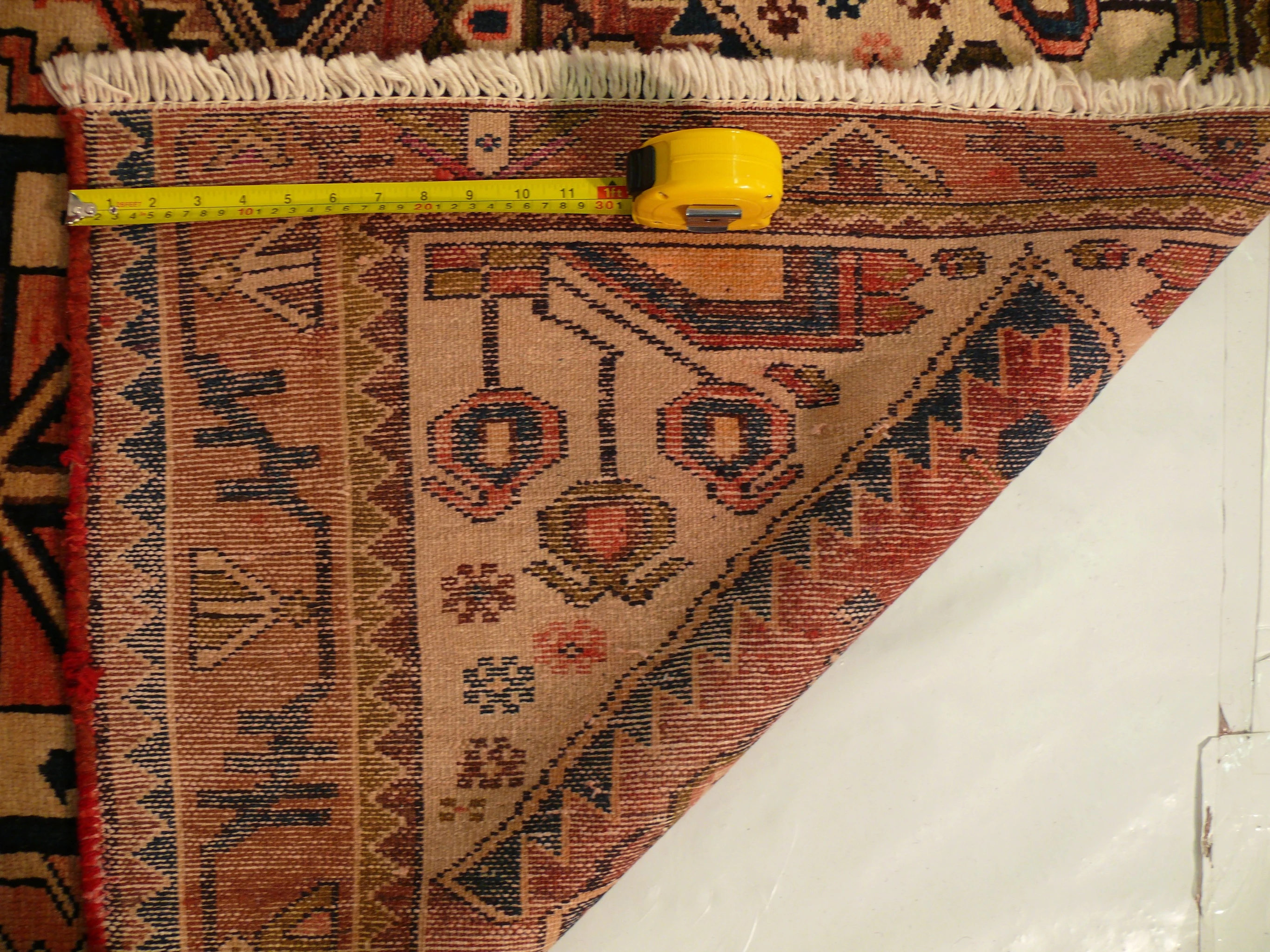 Back view of the 3'4 x 5'2 Antique Persian Khamseh rug showing the quality of the weave