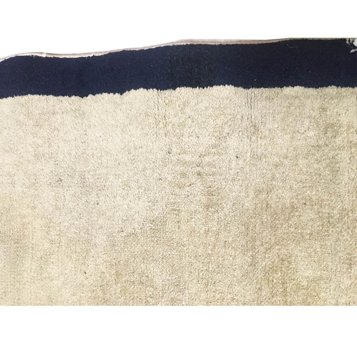 Textural shot highlighting the wear and craftsmanship of the 65-year-old semi-antique rug.