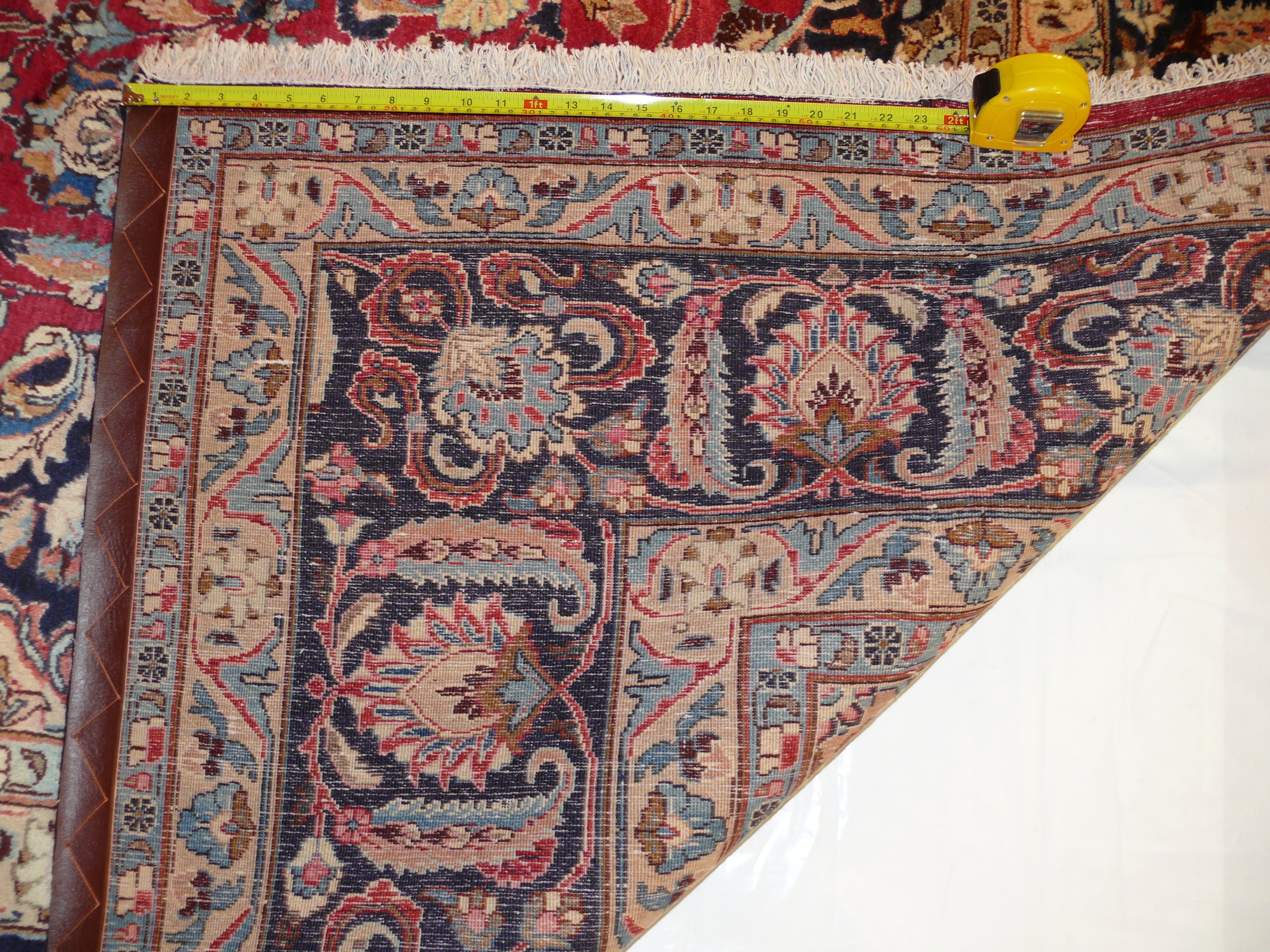 Close-up of intricate designs on 9'8 x 14'8 Persian Kashan Rug