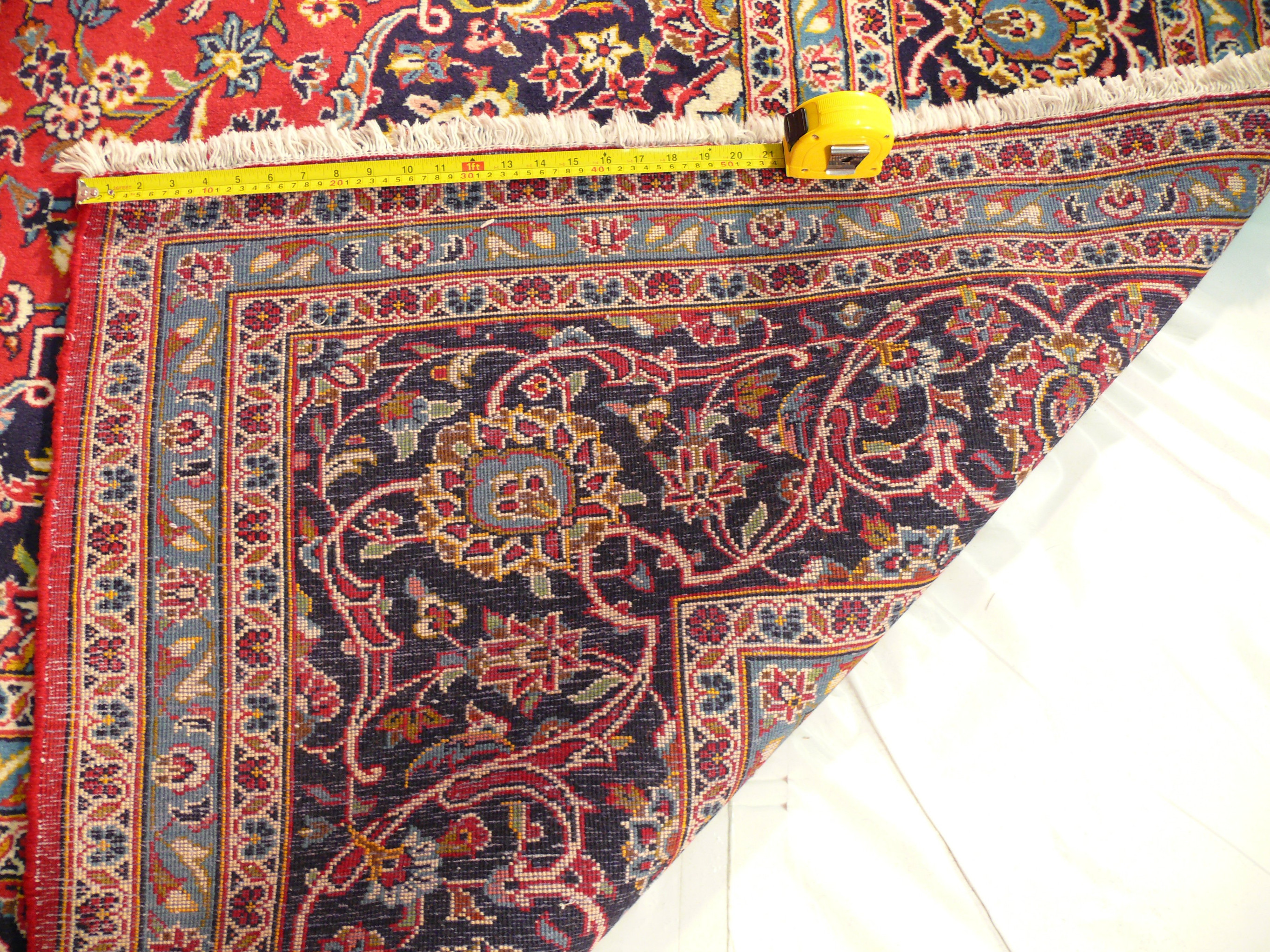 Experience the meticulous craftsmanship of our 10 x 13 Persian Kashan rug from every angle, including the sturdy cotton foundation on the back