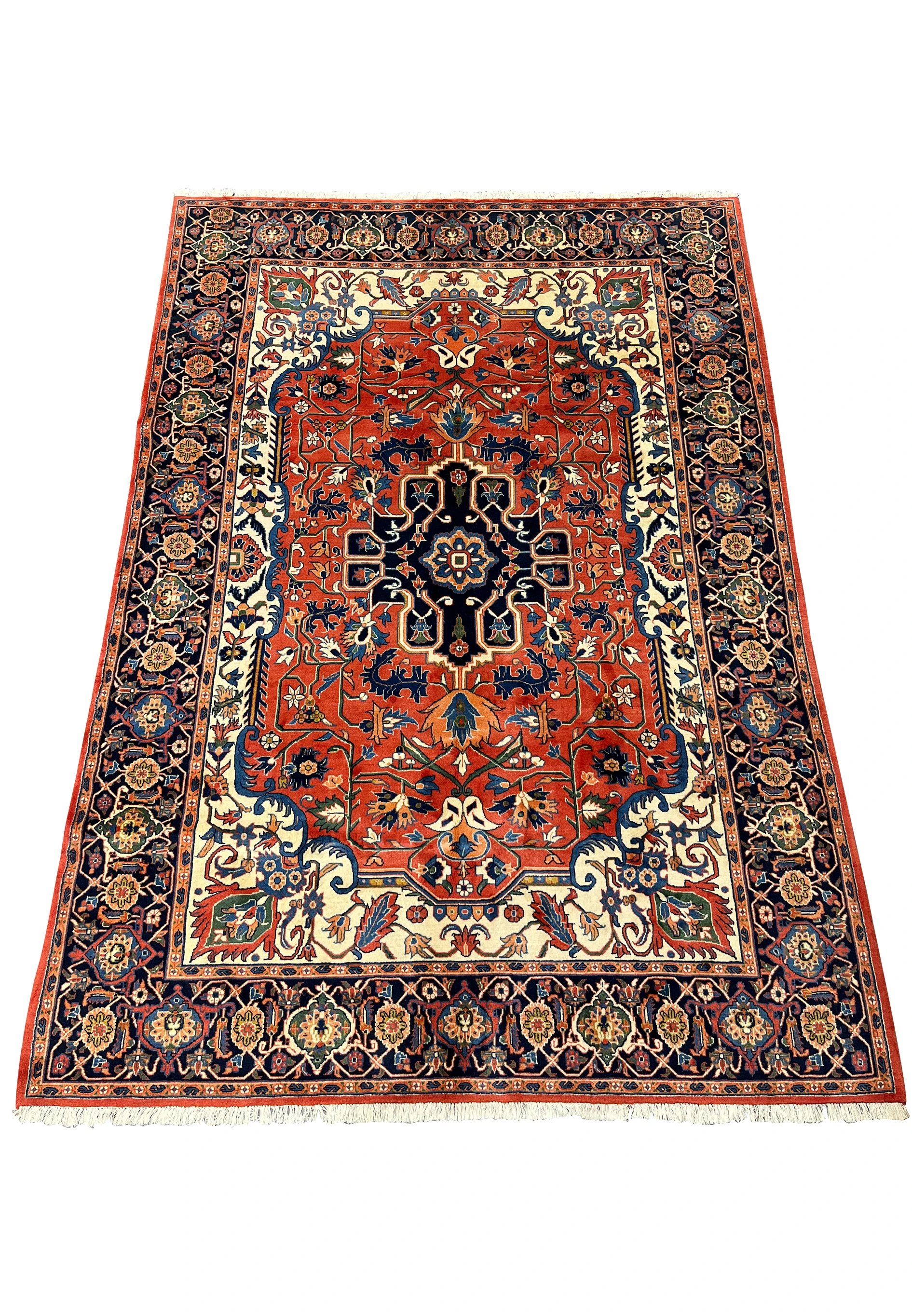 6'7 x 9'7 Geometric Persian Heriz rug laid flat showing bold red field, navy medallion, ivory accents, and classic Heriz layout
