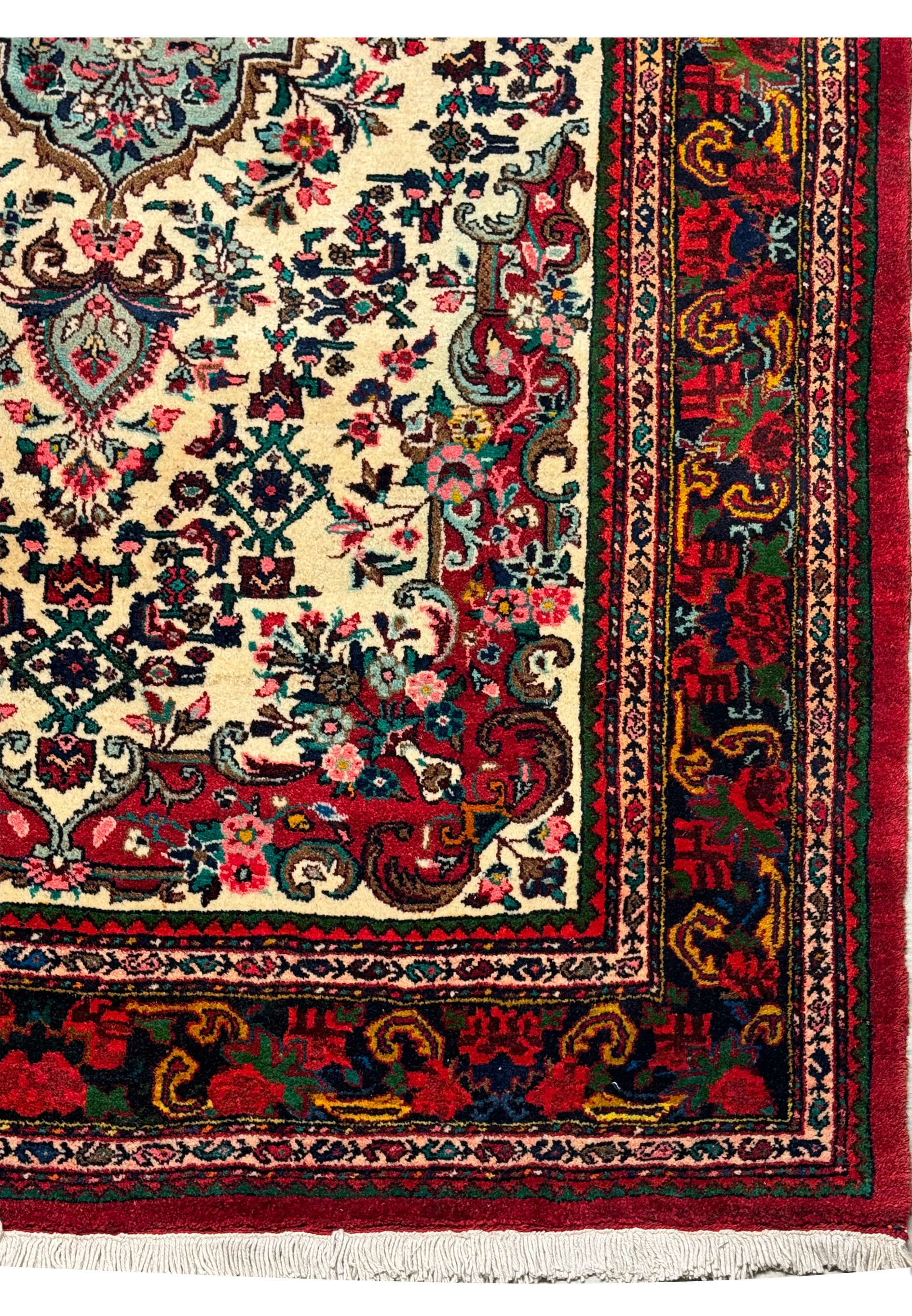 Border section of a Persian Bijar rug, highlighting the intricate weave and floral design