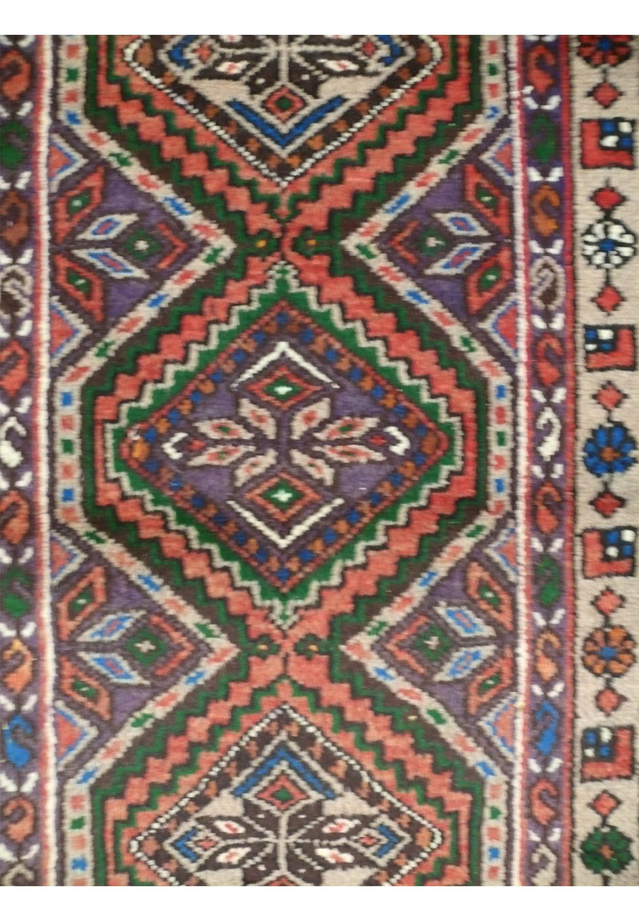 Detailed texture shot highlighting the weave and fabric quality of the Enjlas rug.