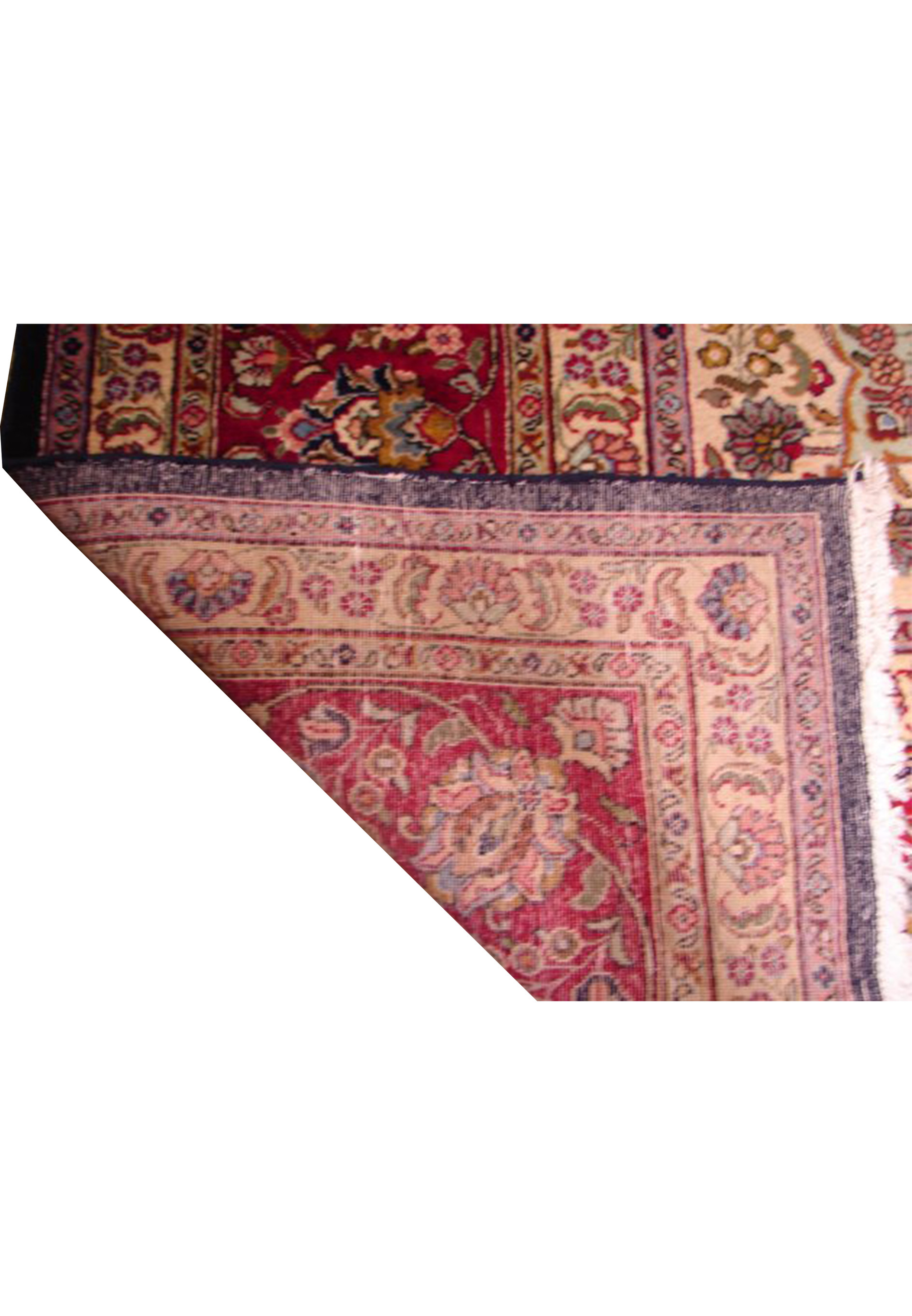 Handwoven Persian Mashad rug, 11'3" x 14'5", highlighting traditional design elements in a spectrum of navy, red, and gold