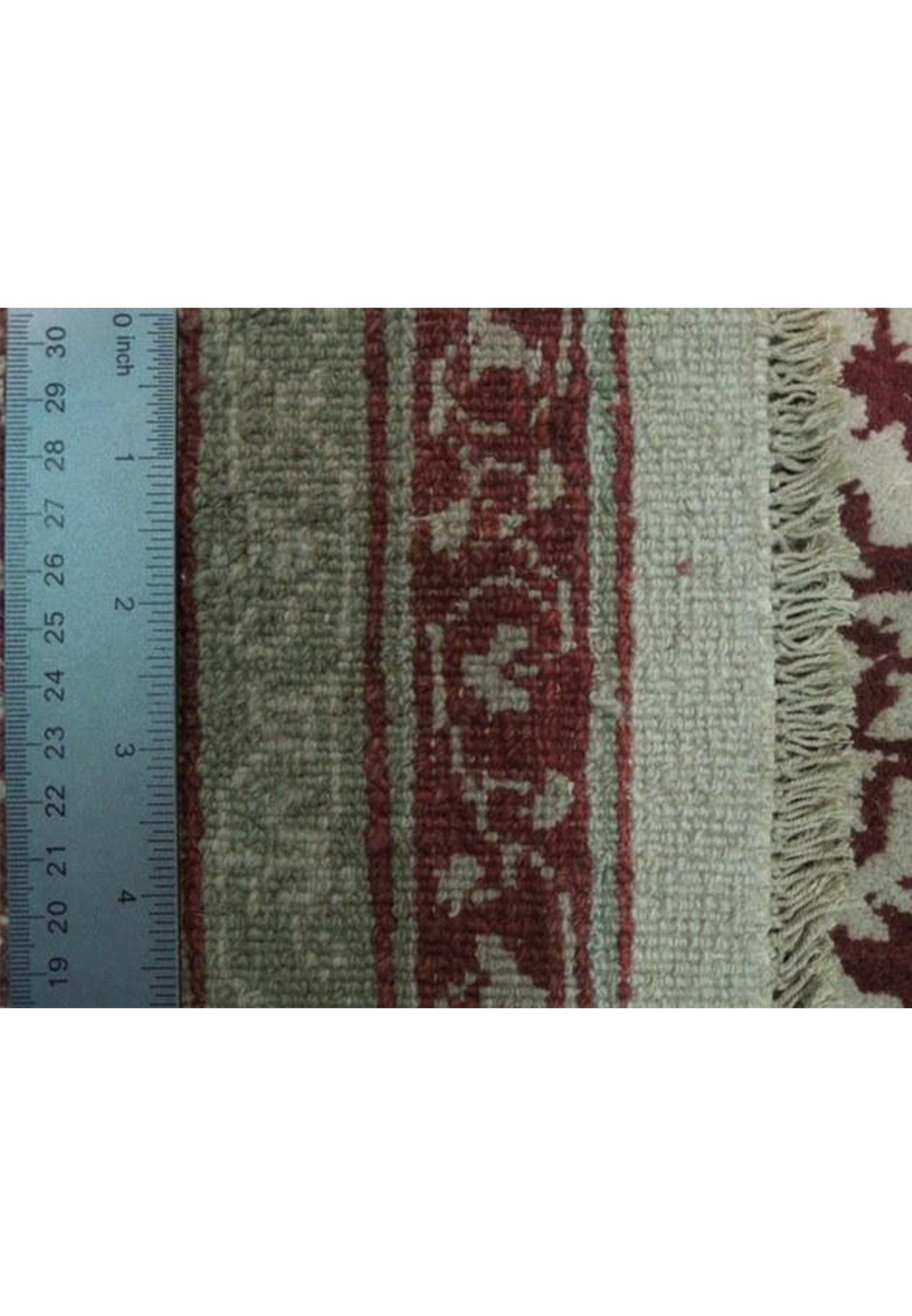 the back of a 9x13 oriental Agra rug