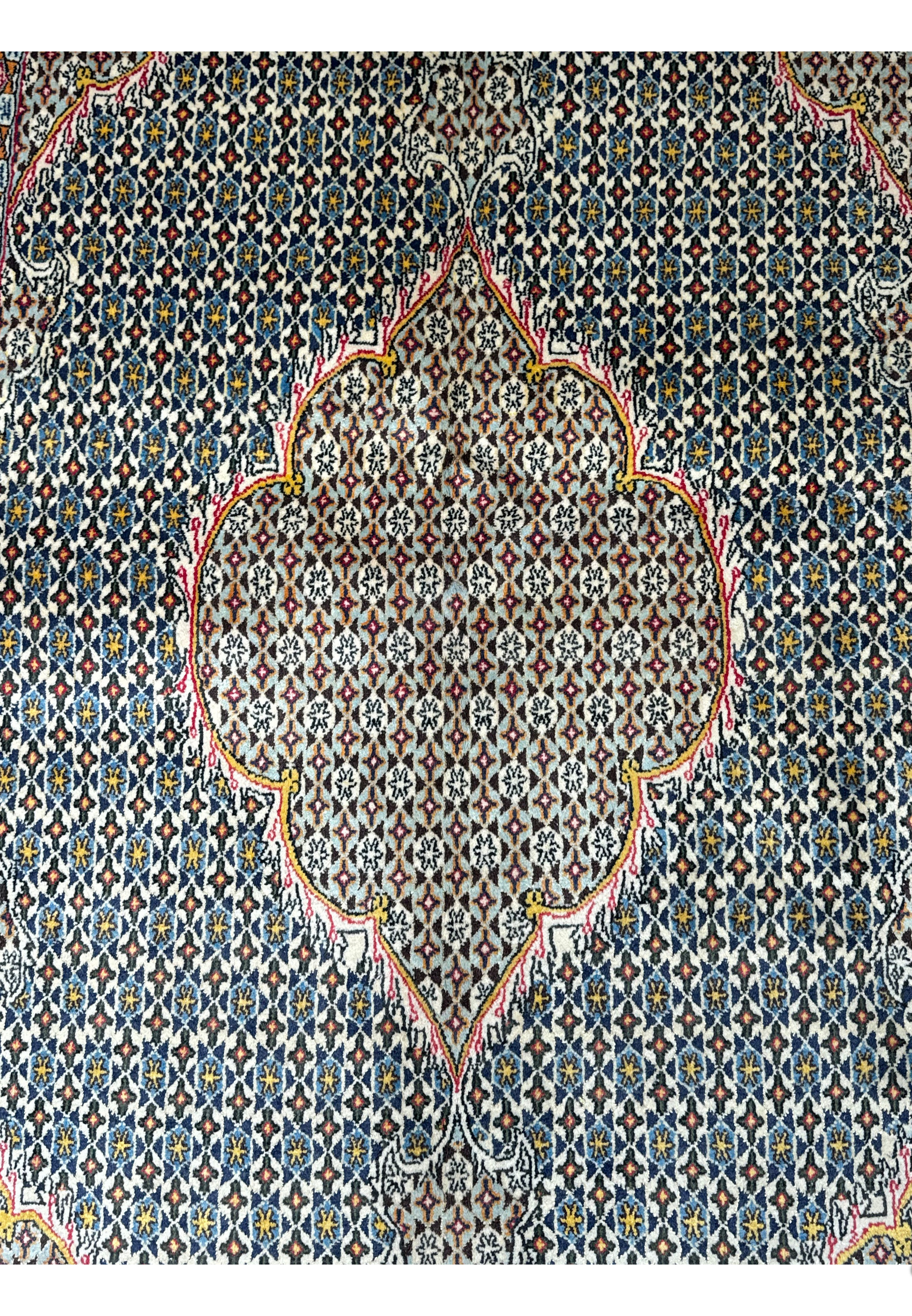 Full display of 4'5 x 7' hand-knotted Persian Qum Rug with central medallion design