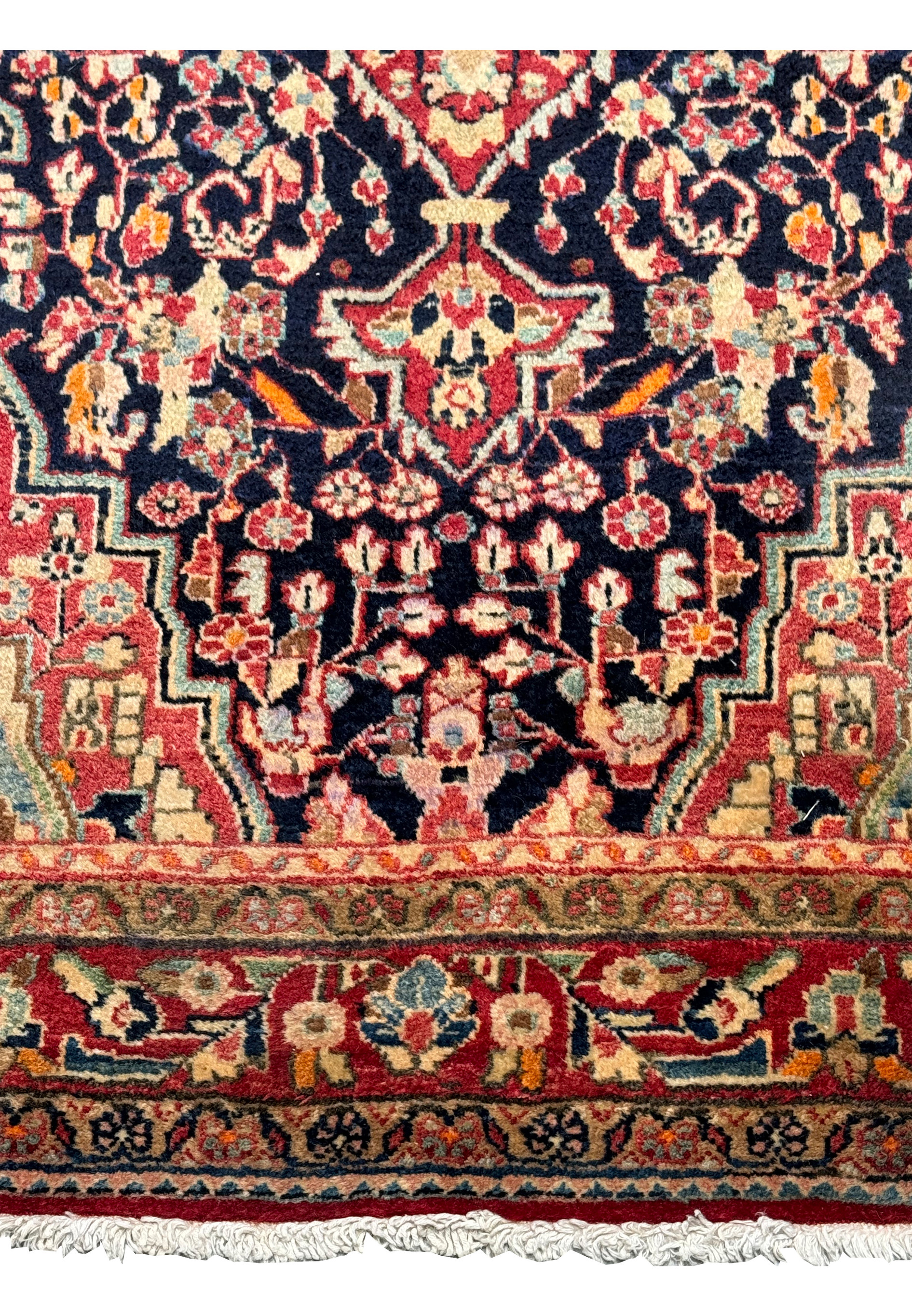 Detailed image of the Persian Sarough Rug's border with intricate patterns in red, cream, and navy, highlighting the fine craftsmanship.