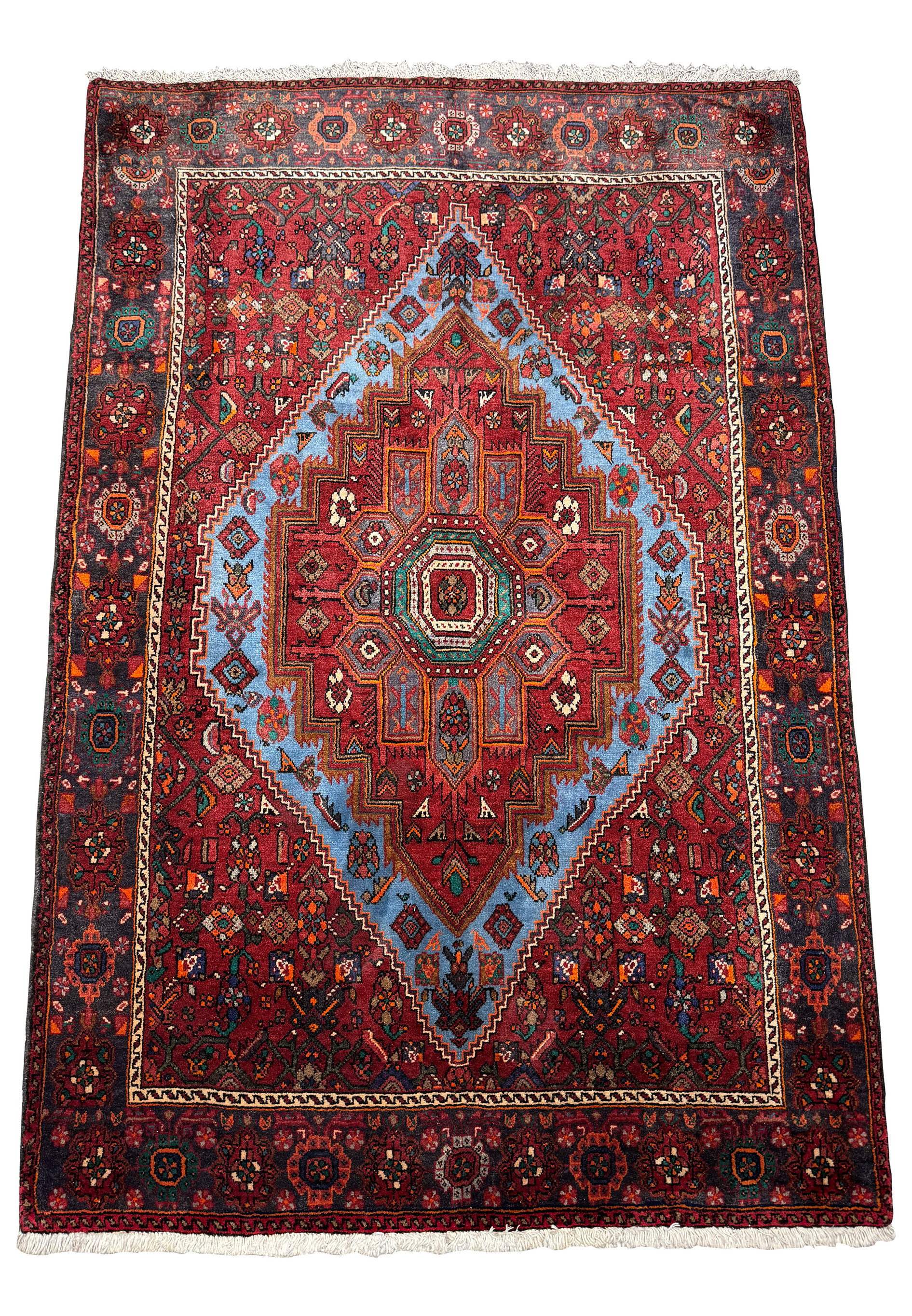 Perspective view of a Persian Gholtogh Rug, showing the detailed patterns that extend across its entire surface