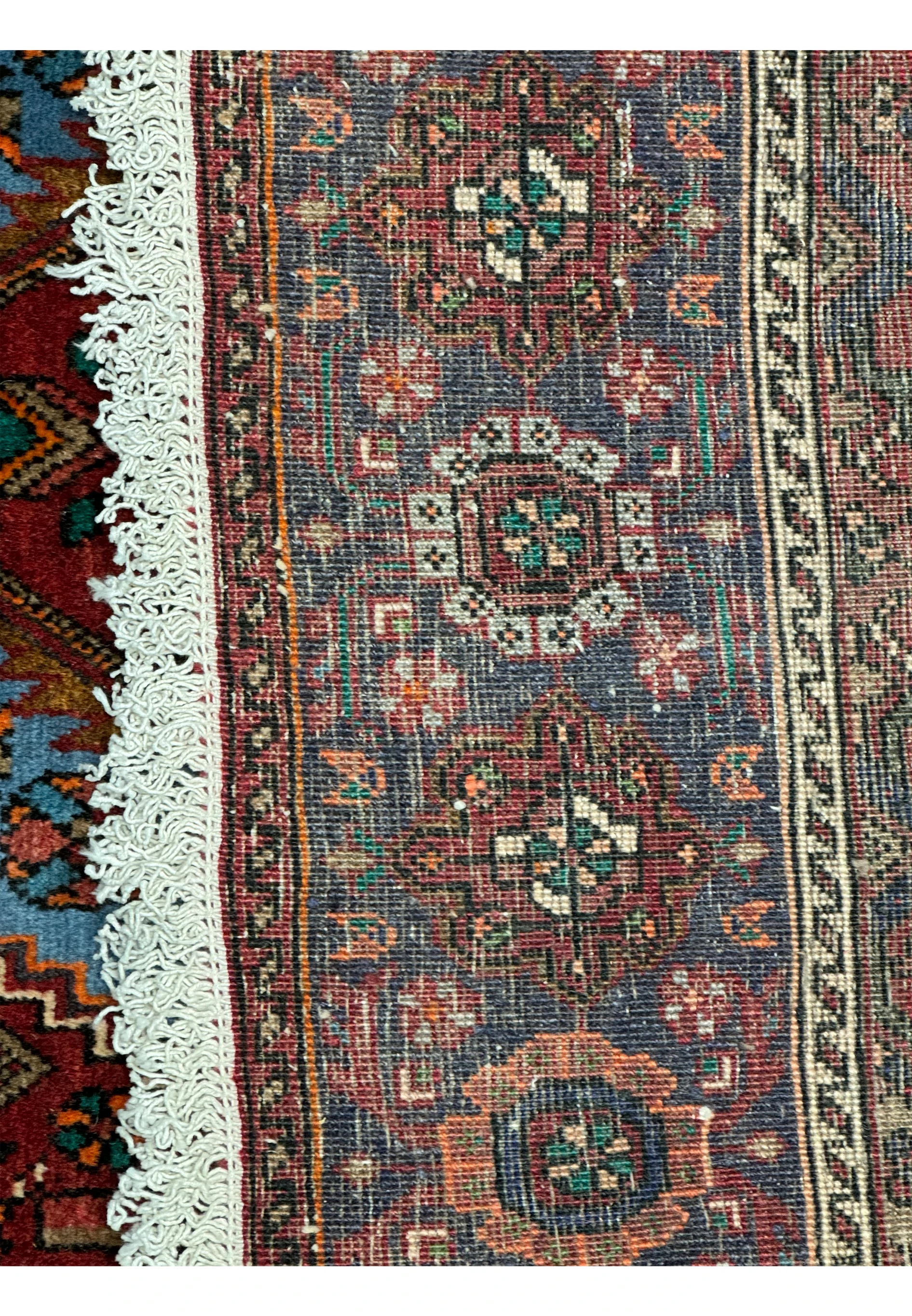 Close-up of the intricate patterns and rich colors of a Persian Gholtogh Rug, with focus on the quality of the wool emphasizing the knots of this 4x6 Gholotgh Persian Rug