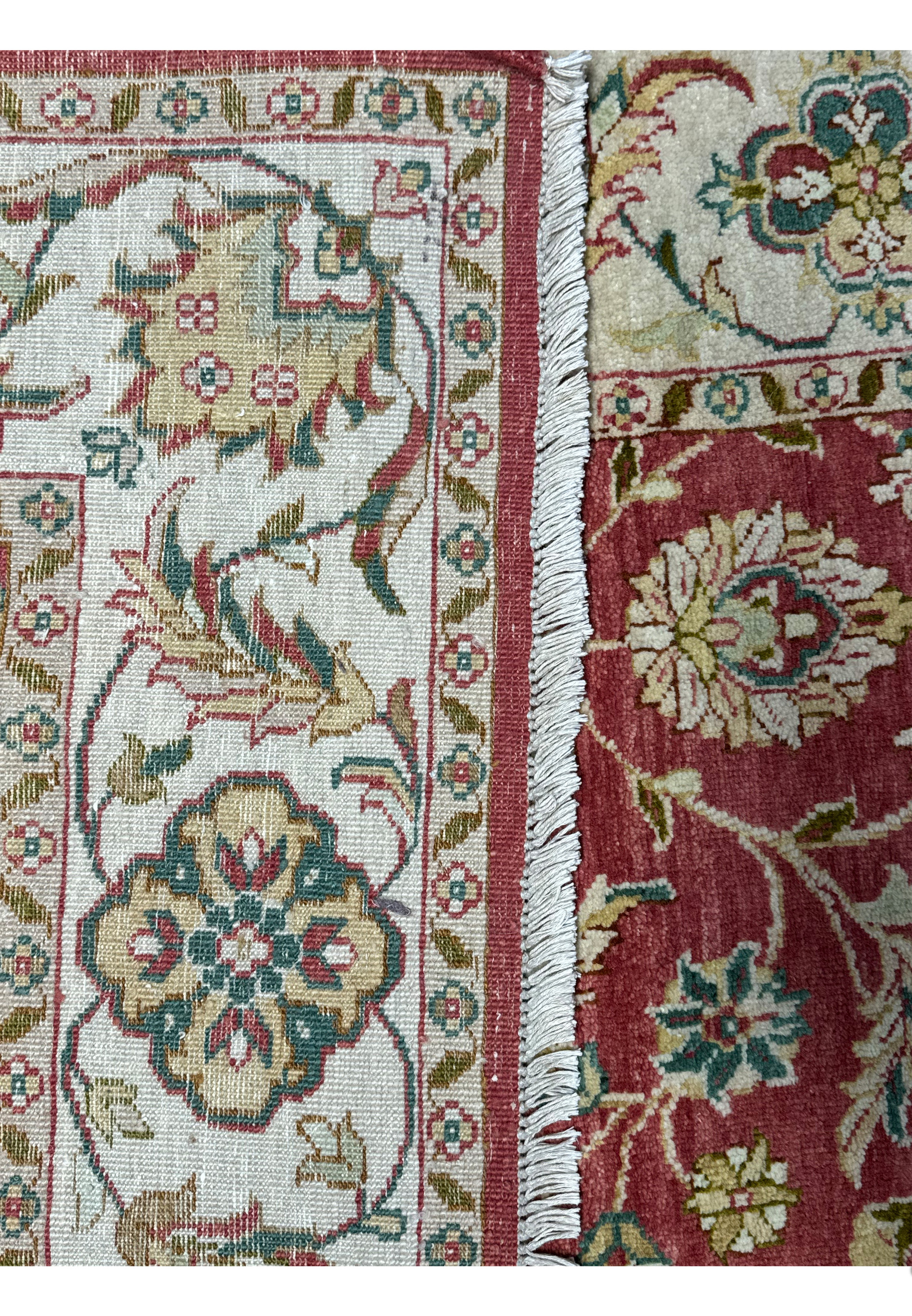 A detailed edge view of a 6x9 Ziegler Rug, showcasing the fine weave and elaborate border design that highlights the craftsmanship of handmade oriental rugs.