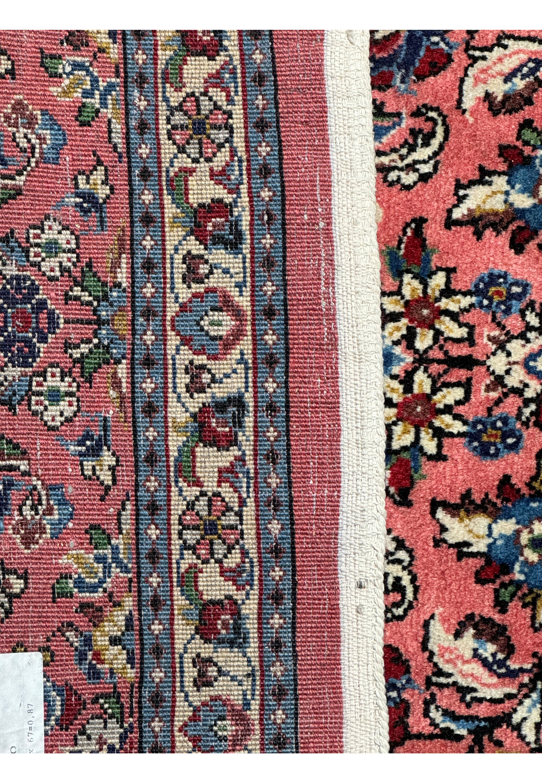 Underside view of a Persian Sarough rug, exposing the tight weave and structure of the rug's back, confirming the high-quality craftsmanship and authenticity.