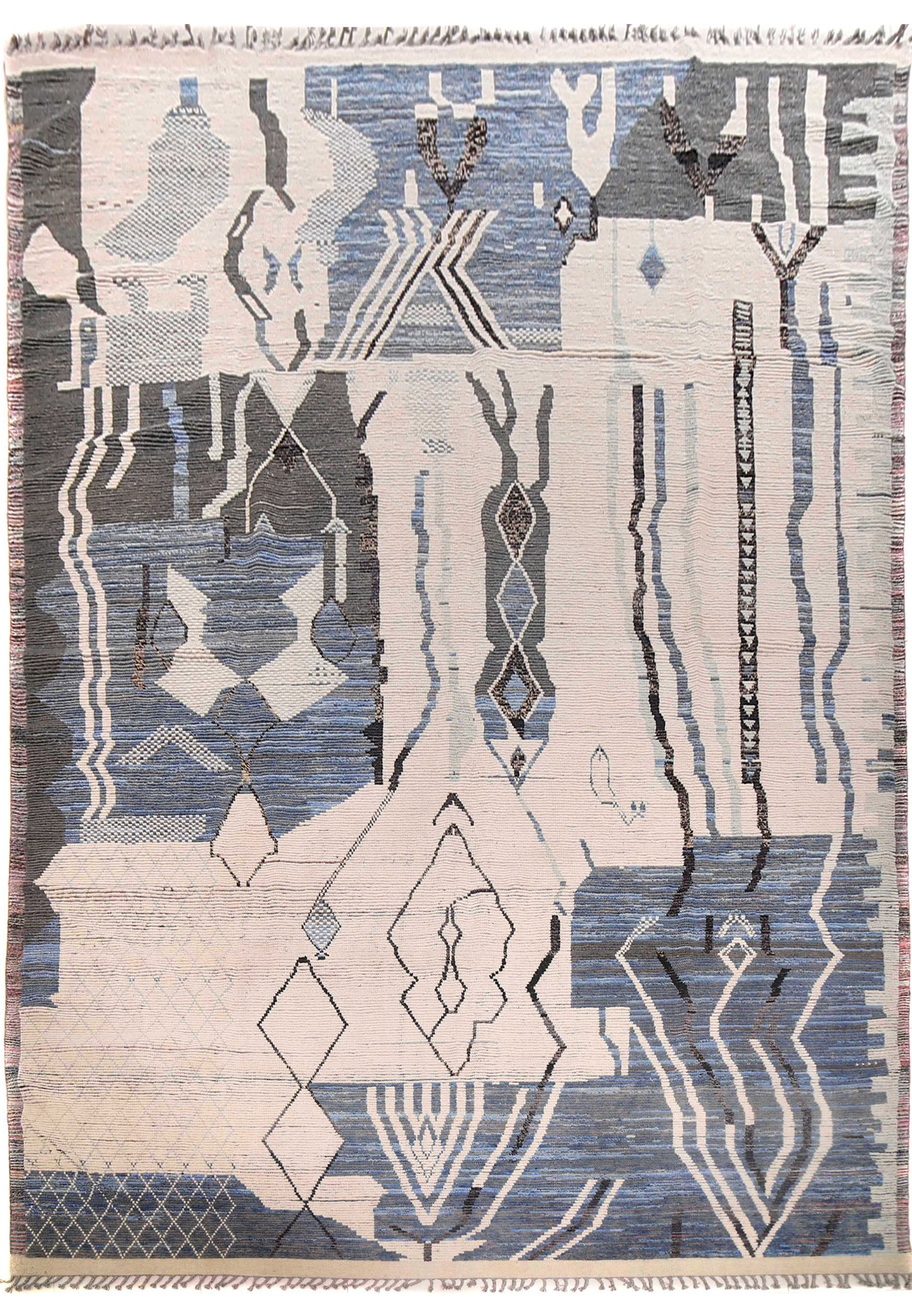 A 12 x 19 Modern Moroccan Oversize Rug displayed flat, featuring abstract designs in shades of navy, steel grey, charcoal, and ivory with fringe details.