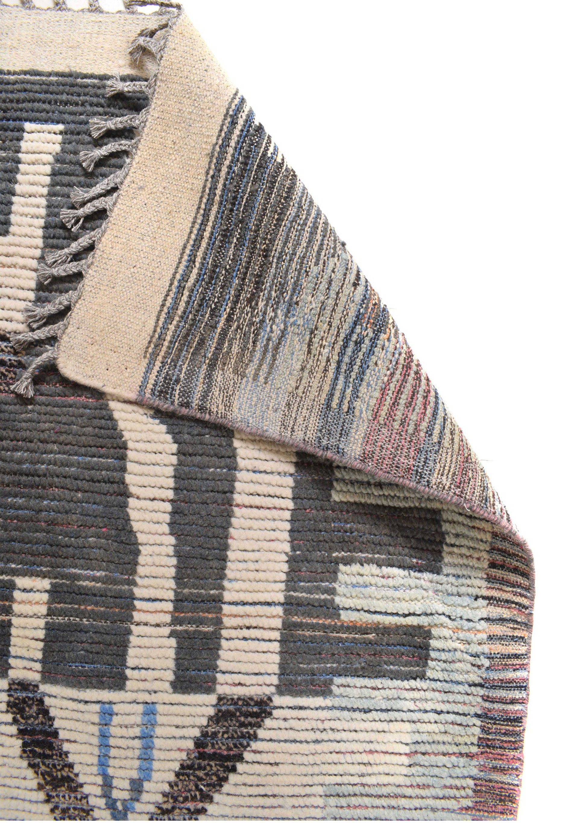 A folded section of the Moroccan Rug, showcasing the texture and thickness of the weave.