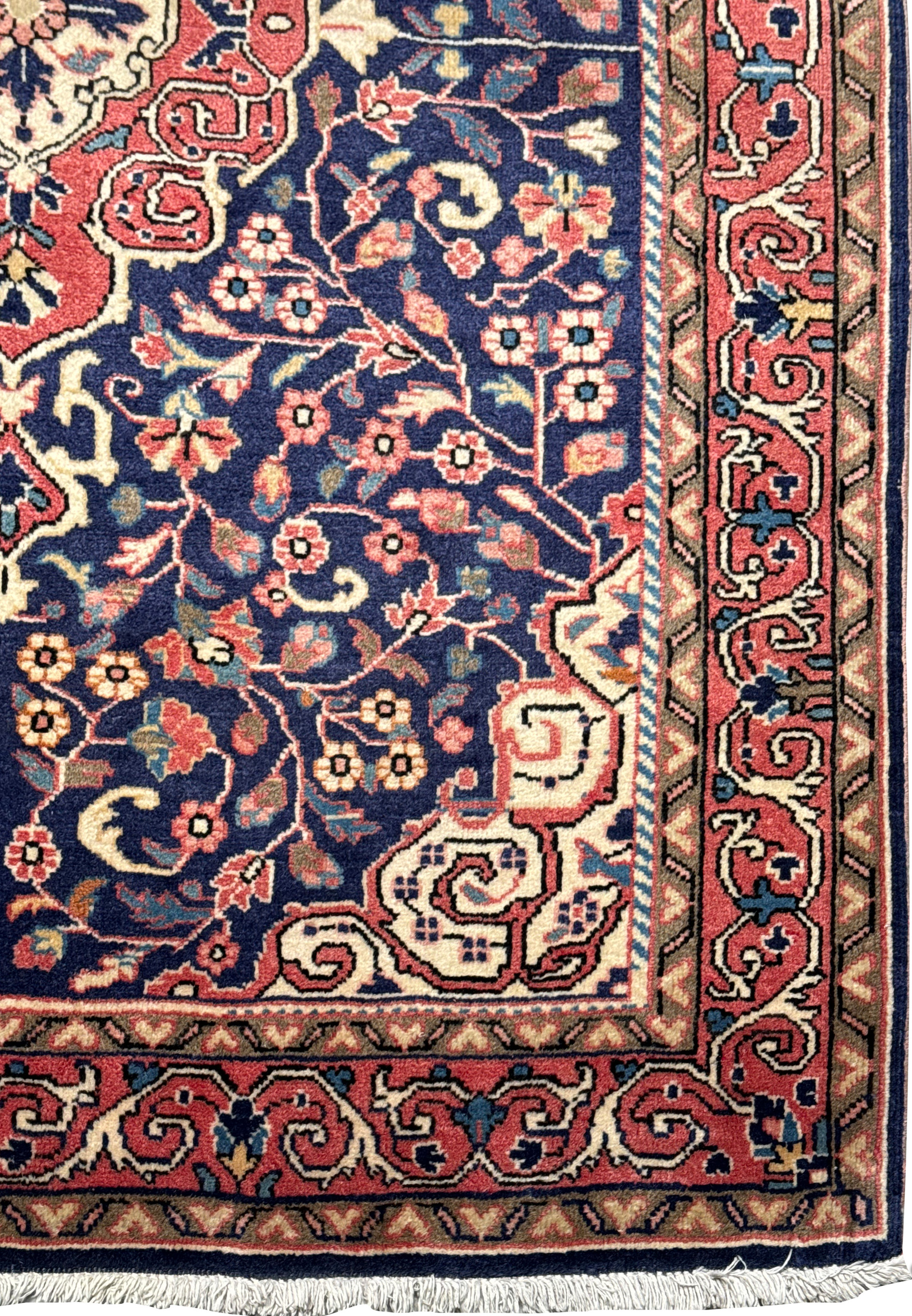 Corner detail of a Vintage Persian Sarough Rug, with a close-up on the delicate patterns and color harmony