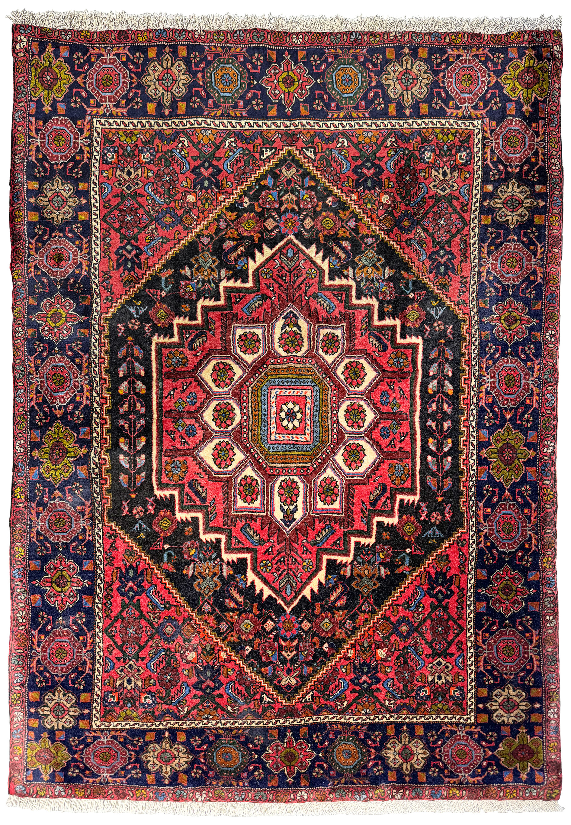 Top view of a Persian Gholtogh rug laid flat, displaying the full intricate design and vibrant color palette with a prominent red central medallion