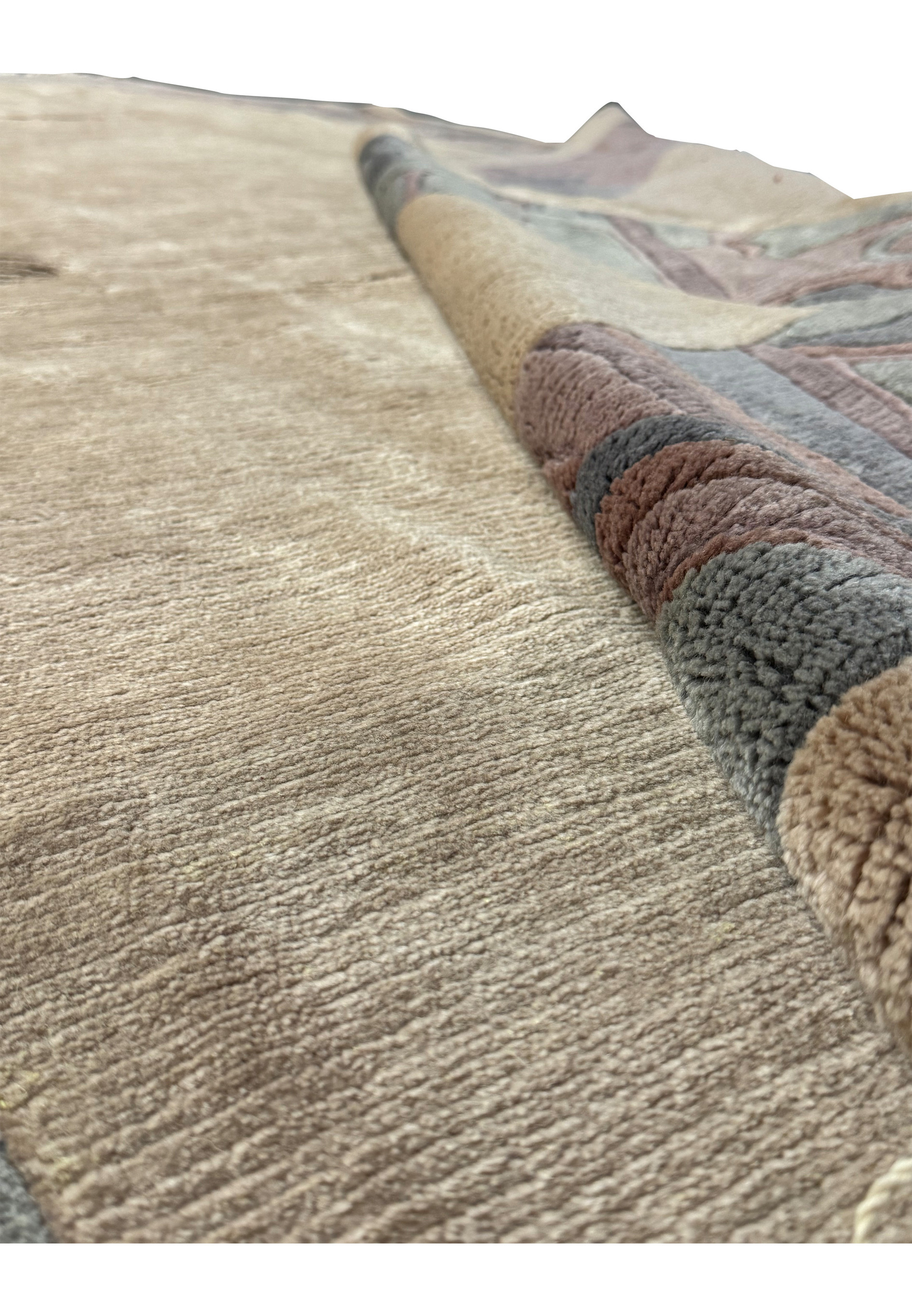 Close-up on the edge of the Modern Royal Tibetan rug displaying the transition from the border to the central field