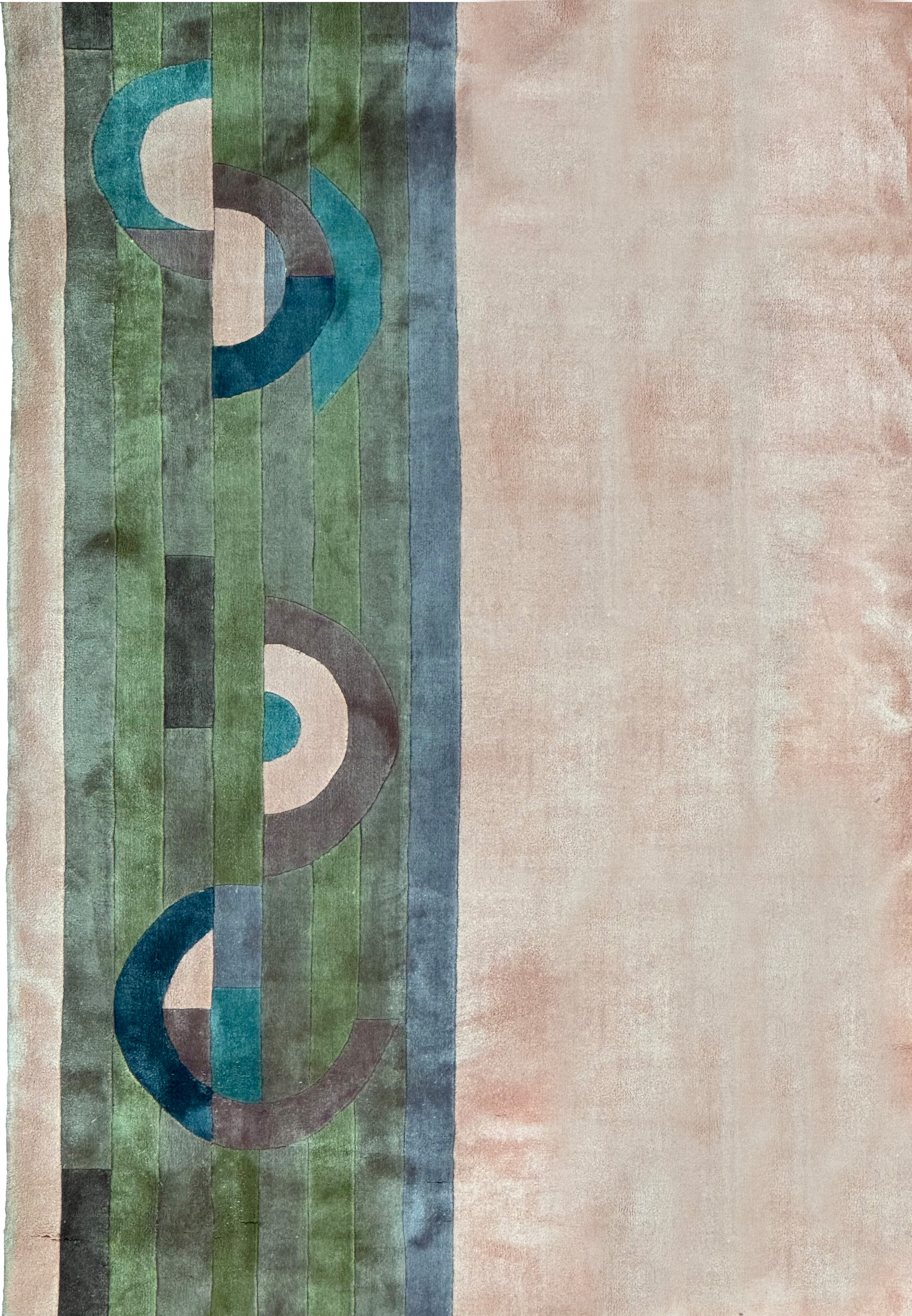 close up of the midfiled and border highlighting the silk and colors of this 9x12 art deco rug