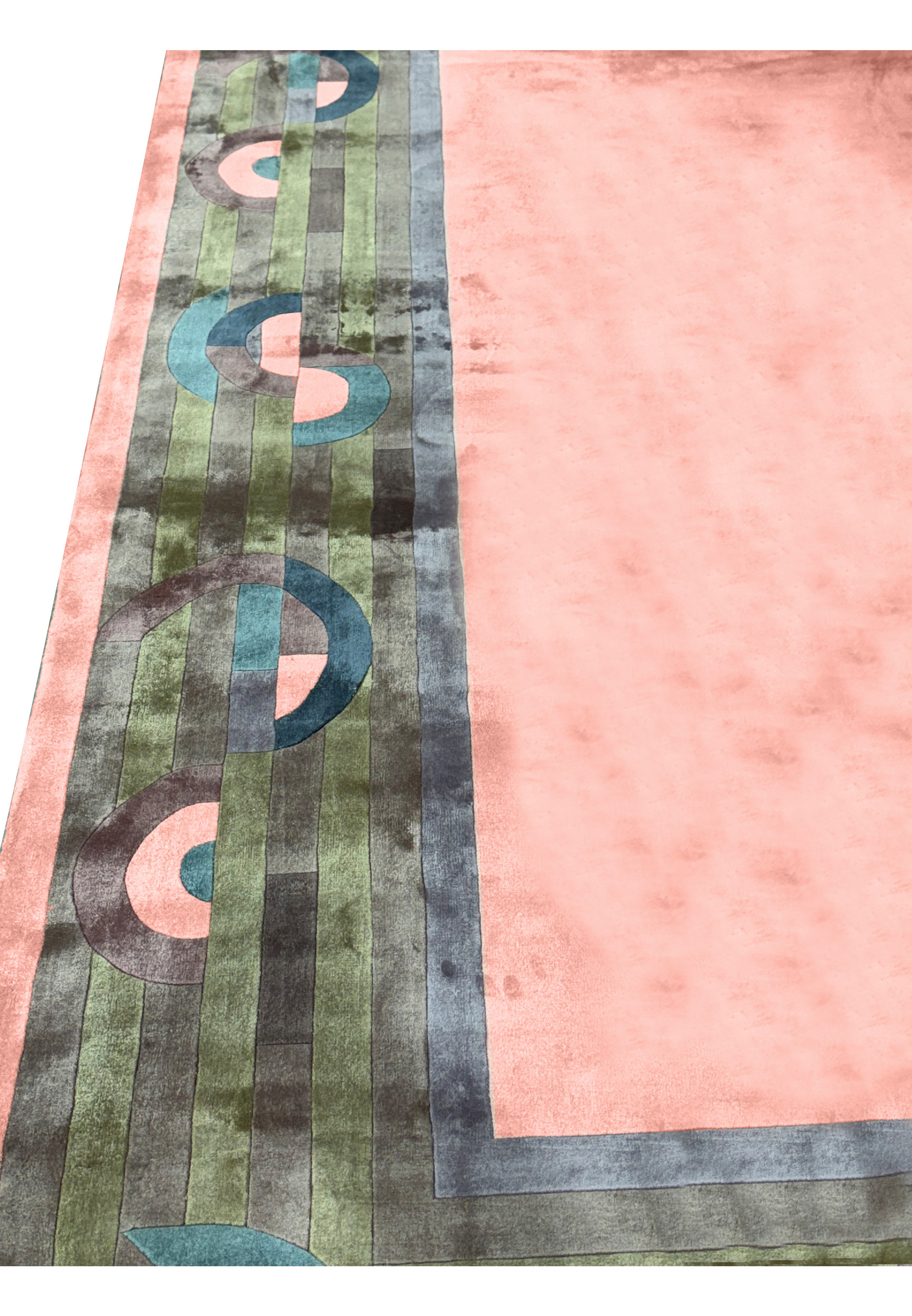 Detailed view of the rug's central pattern with interlocking shapes and color gradients.