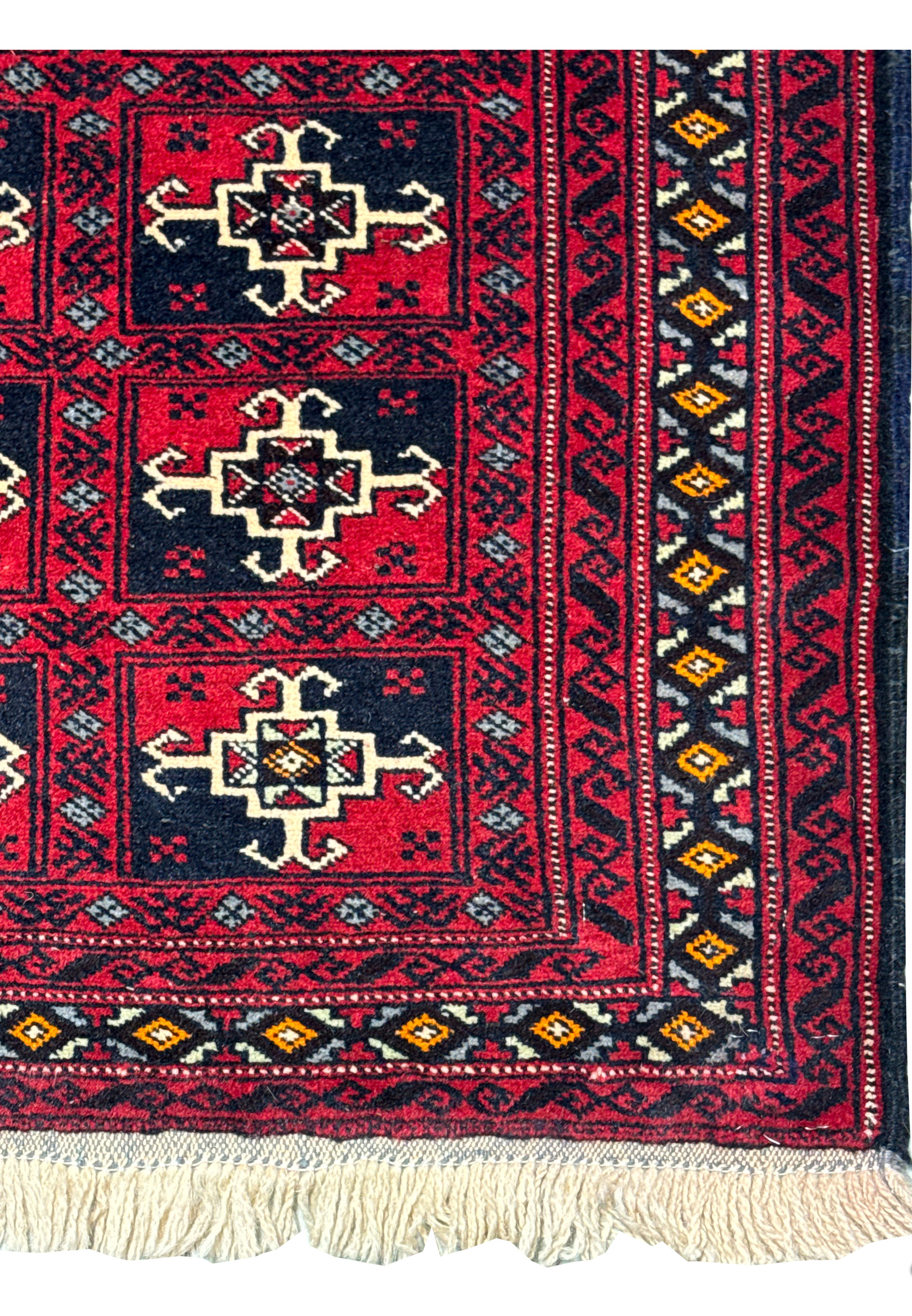 Close-up of the central part of the rug, focusing on the geometric patterns and the color contrast.