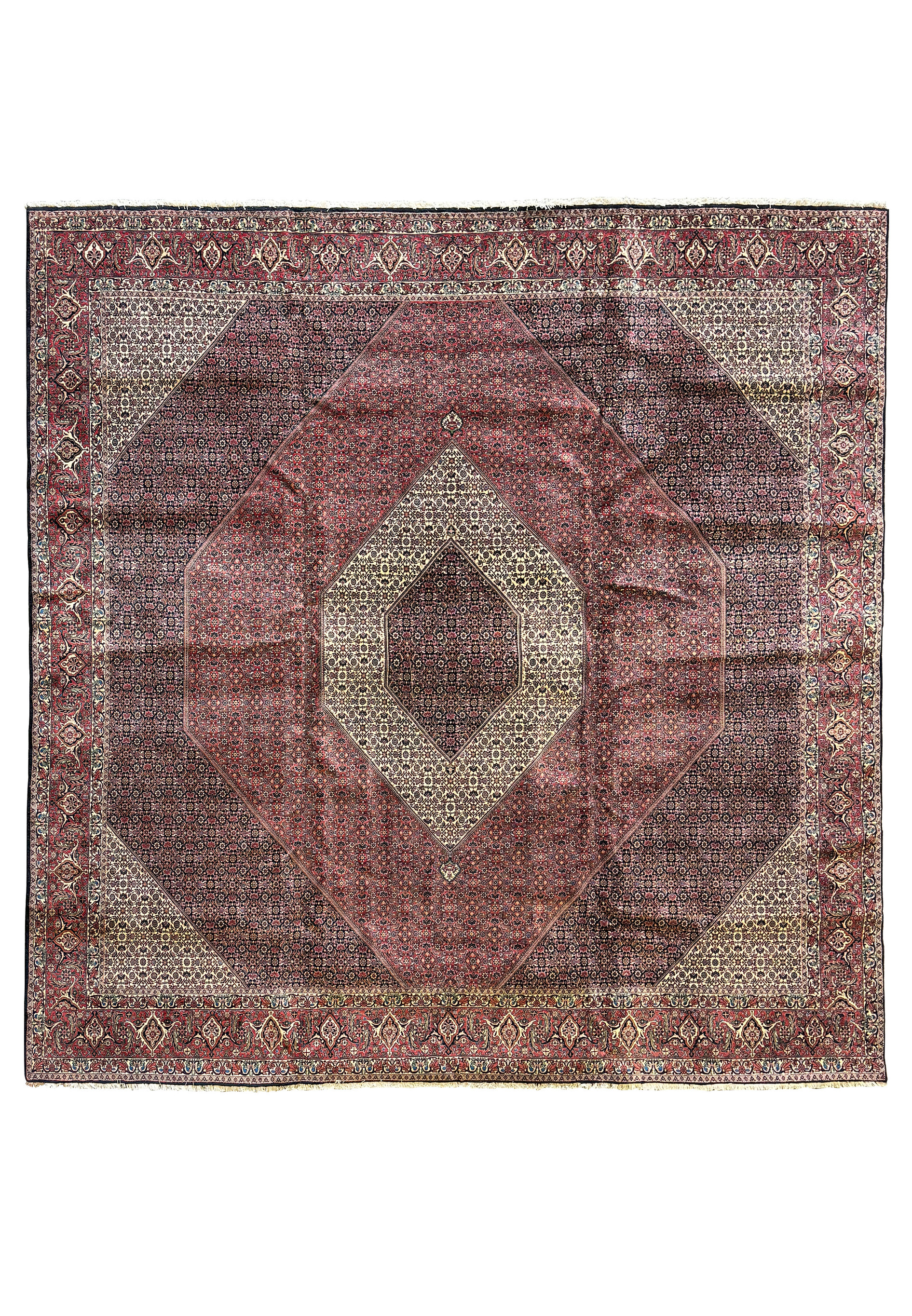 Full view of a grand 13 x 13 Persian Bijar square rug laid out to showcase its rare size and detailed geometric and floral designs in deep reds and blues