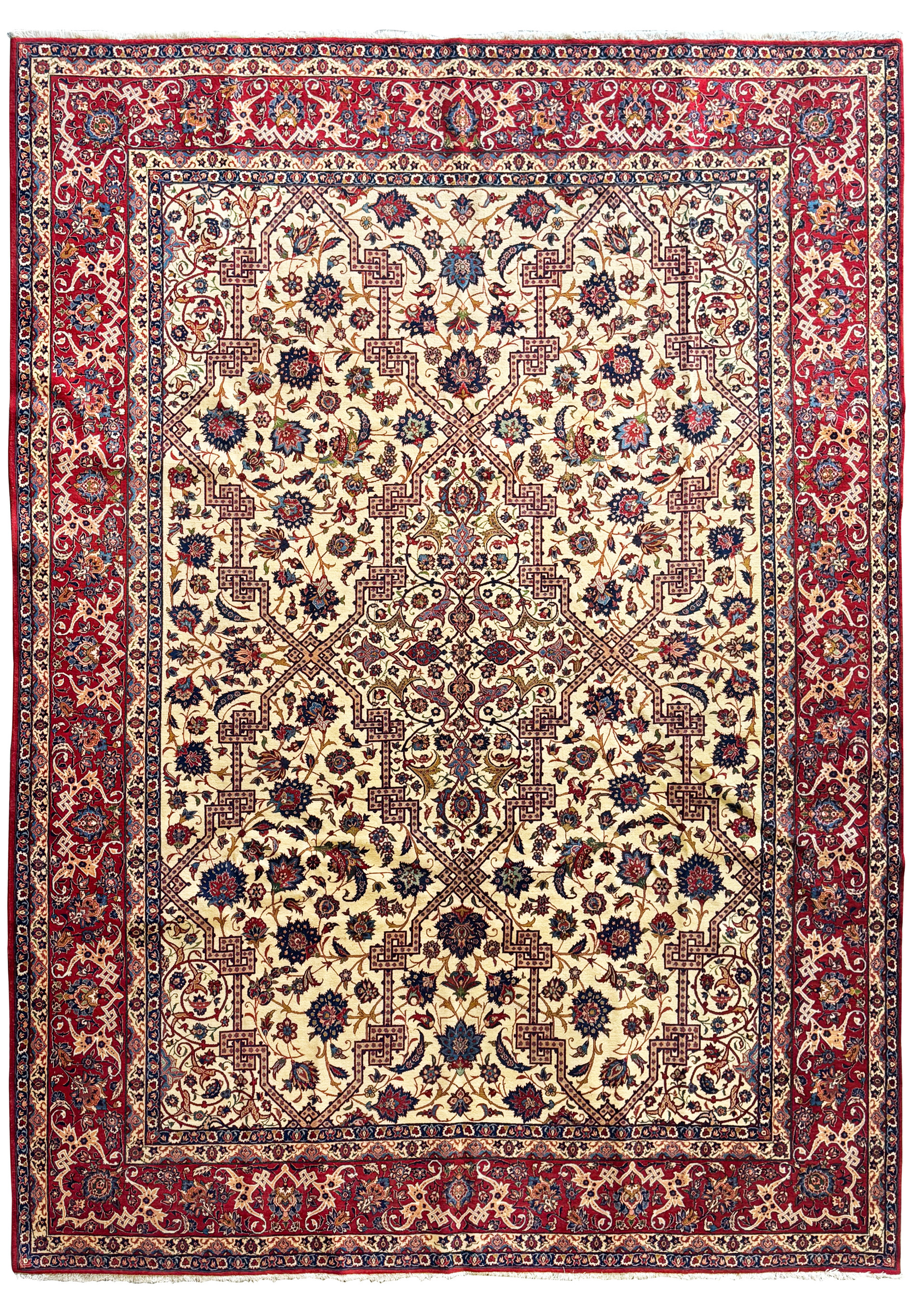 Full view of a 11x15 Persian Isfahan wool and silk rug with intricate patterns on an ivory field and deep red borders.