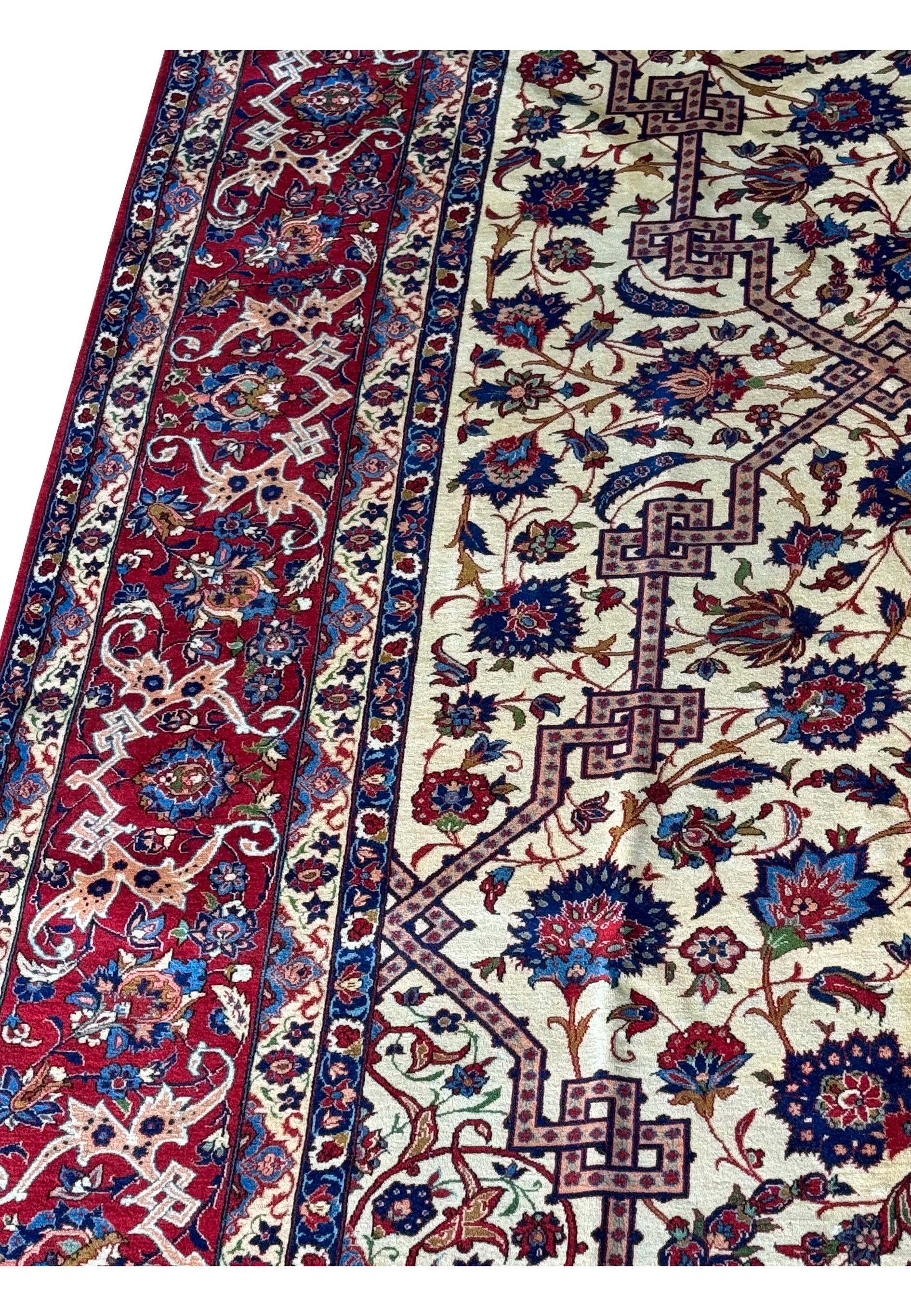 Vertical view of the Persian Isfahan rug, highlighting the intricate border designs along the length of the rug.
