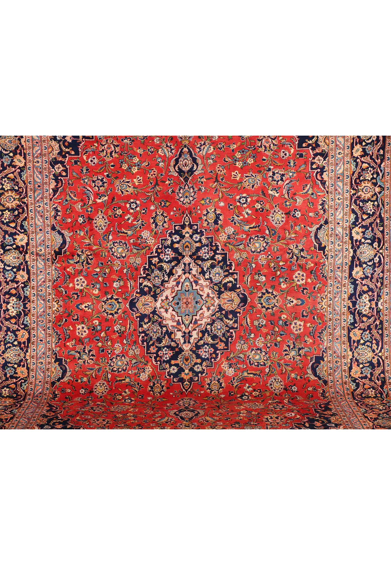A close-up of the rug's border, illustrating the fine details and color contrast in the patterns that edge the rug.