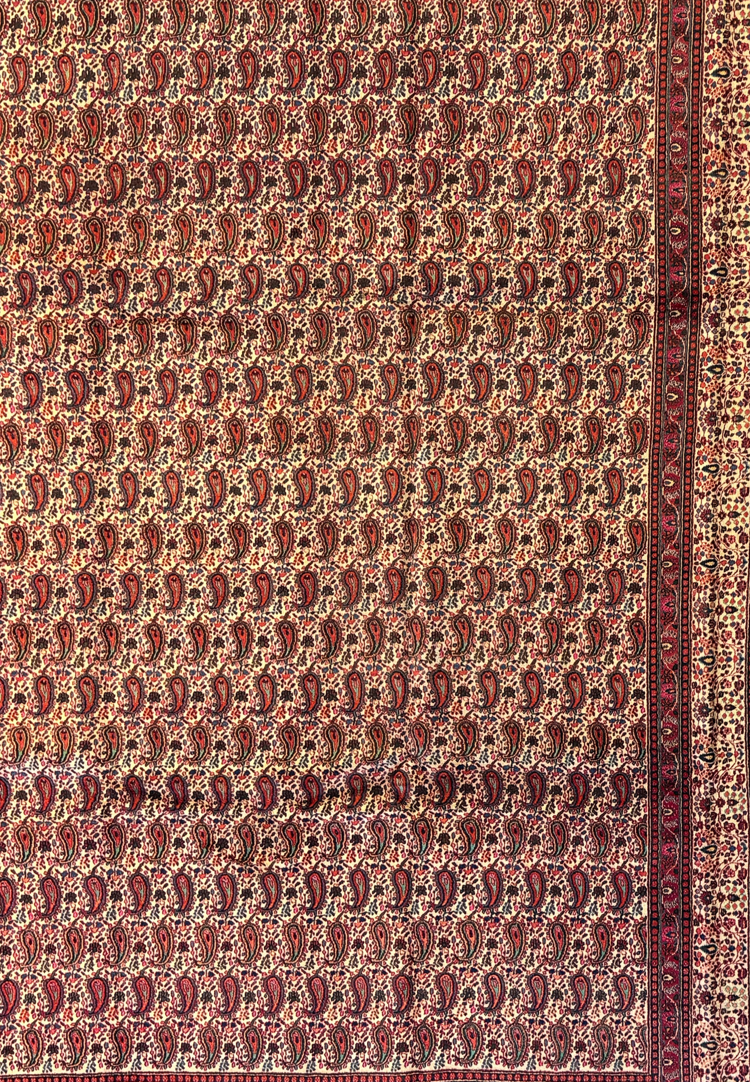 Close-up of the central field of a Persian Moud Rug, focusing on the detailed Herati patterns intertwined in a repetitive, elegant design with red and blue hues