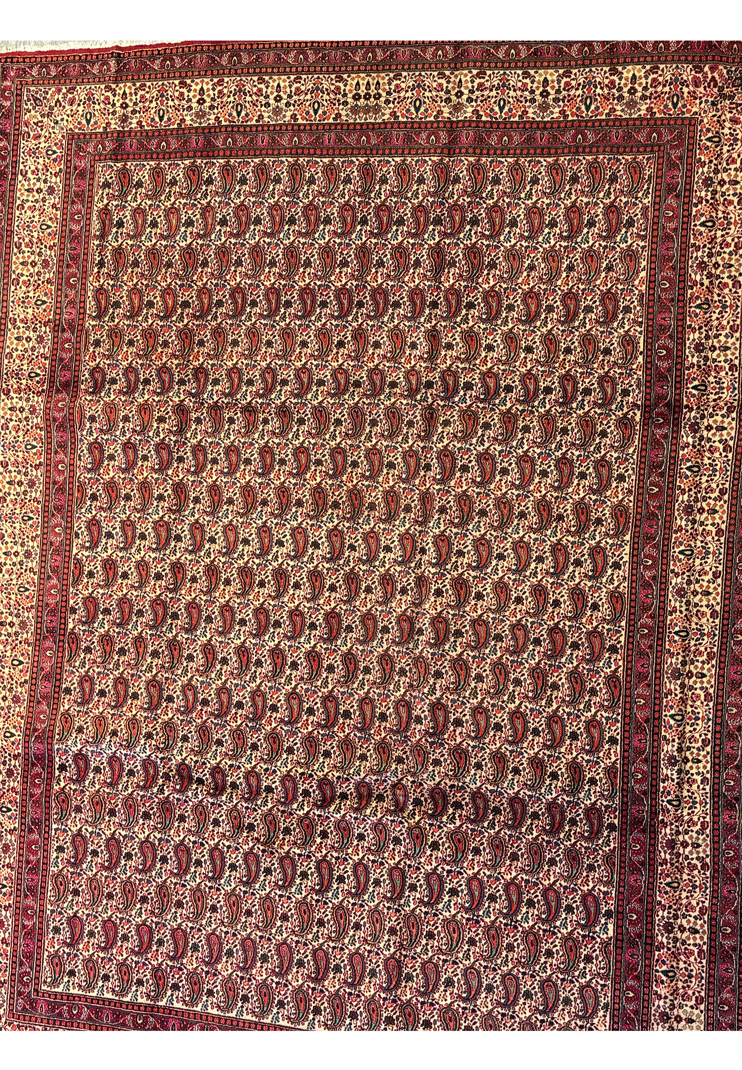 Perspective shot of the Persian Moud Rug, with a focus on the plush pile and intricate, dense patterning that characterizes this luxurious handwoven piece