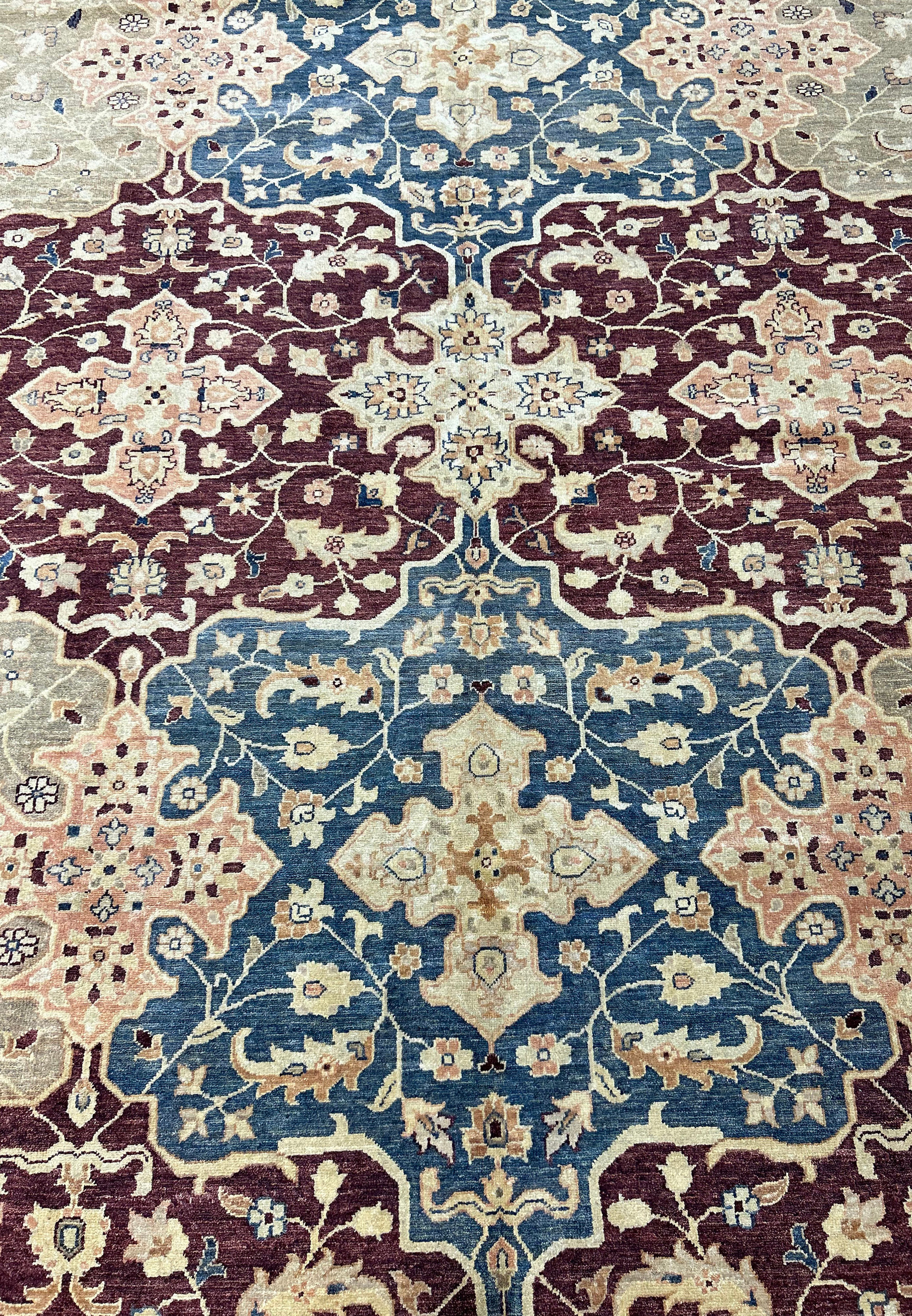 Close-up of the rug's detailed patterns, focusing on the intersection of different motifs. The vibrant colors and the fine craftsmanship of the handwoven rug are prominently displayed.