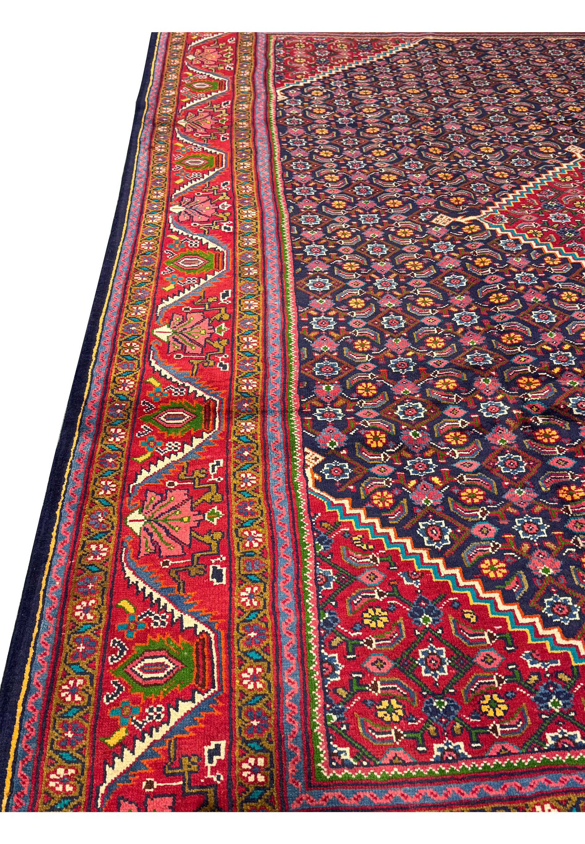 Rolled-up Persian Mahal Rug, highlighting the plush pile and the intricate patterns visible even in a folded state. The vibrant colors and detailed designs are evident, showcasing the high quality of the hand-knotted wool. This image emphasizes the rug's durability and luxurious texture, making it clear that this Persian Mahal Rug is not only a beautiful decorative piece but also a long-lasting addition to any home.