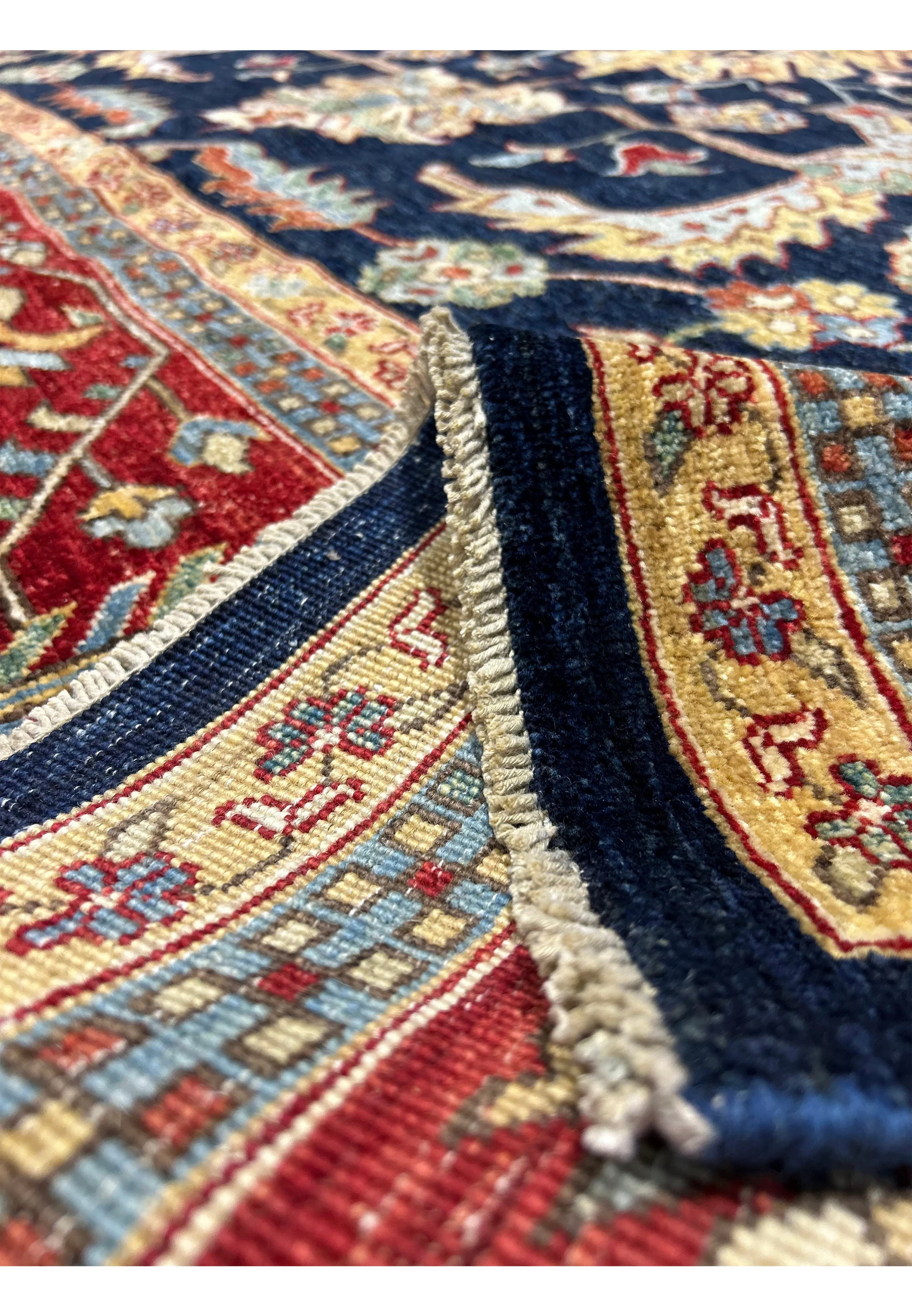 Close-up of the edge of a Ziegler rug, showing the high-quality weave and detailed border patterns.