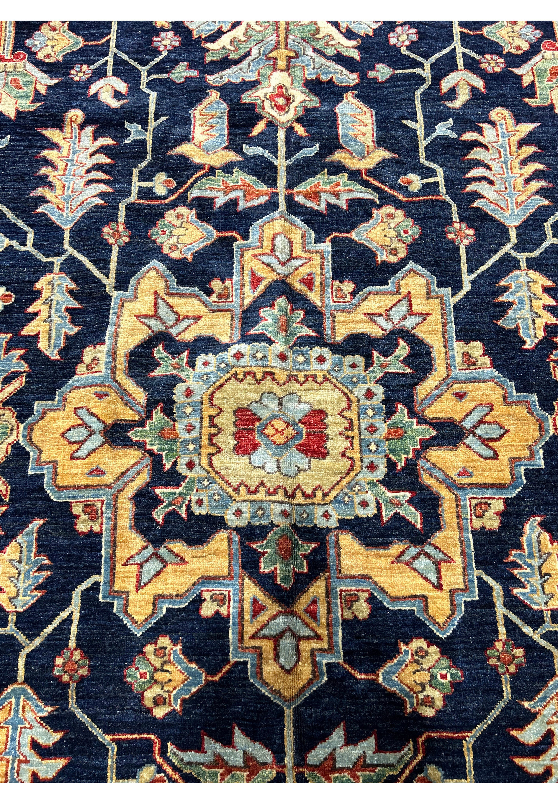 Close-up of the central medallion on a handmade Ziegler rug, showcasing detailed motifs and harmonious color combinations.