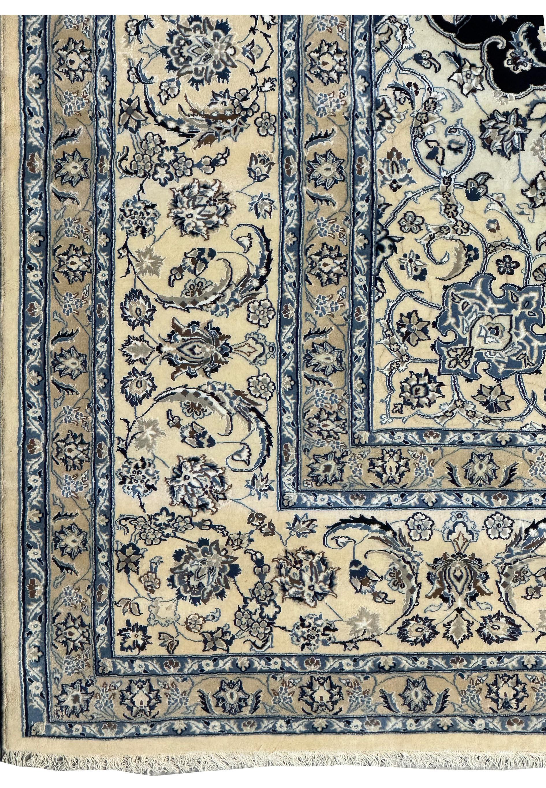Corner border of the Nain wool and silk 13'2 x 19'4 Persian rug