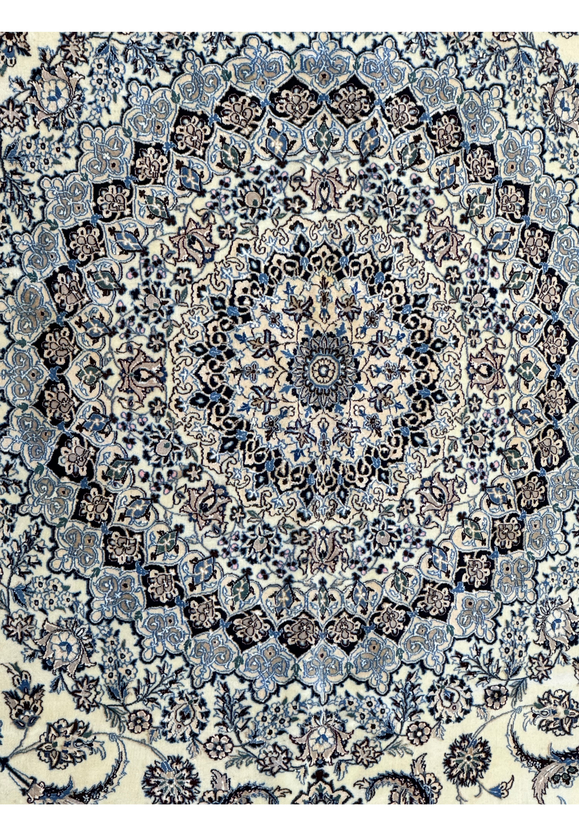 Close-up of the corner and border patterns on a 13 x 20 Persian Nain 9LAA Wool & Silk Rug